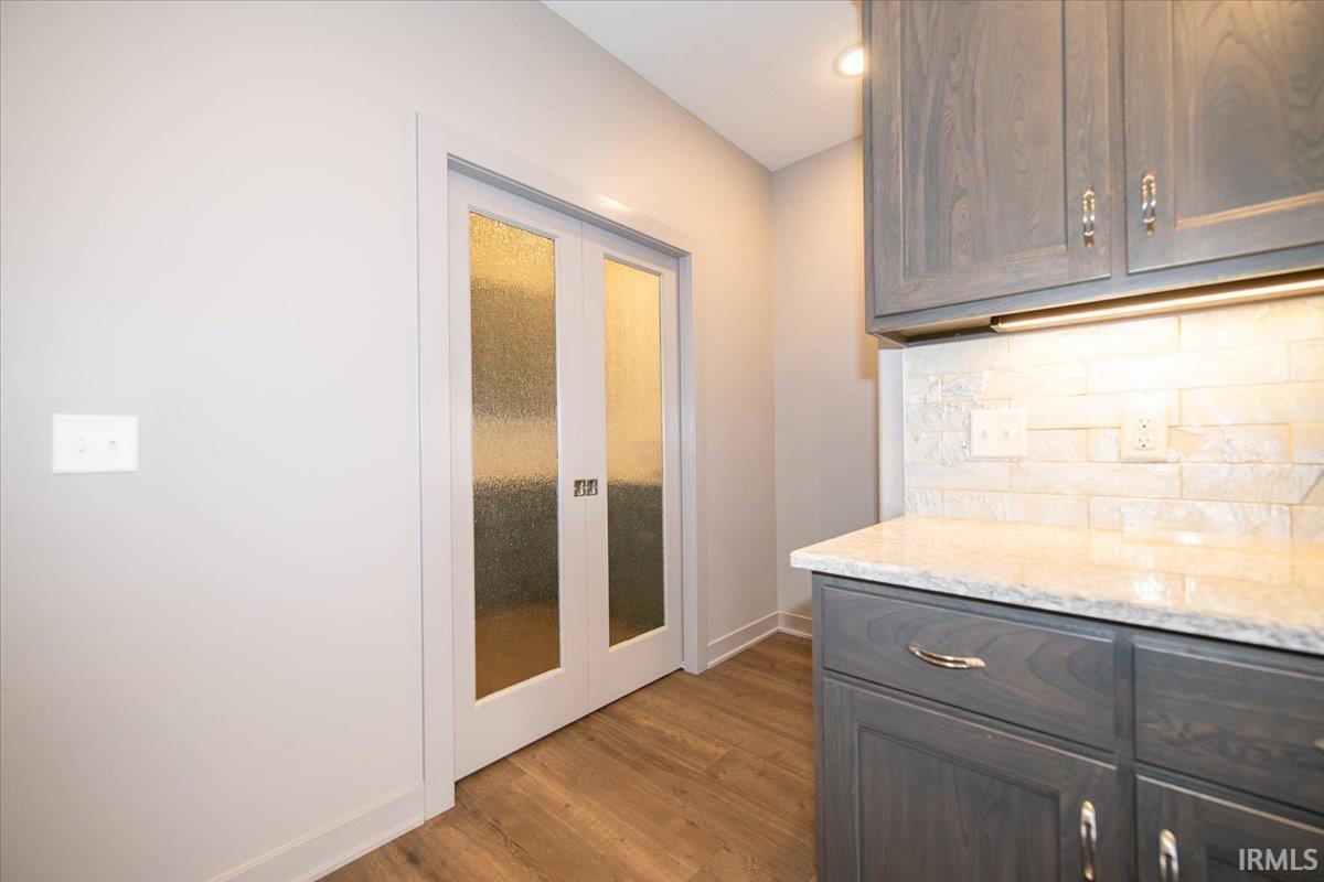 The Butler's Pantry with Double Doors Accented with Glass.