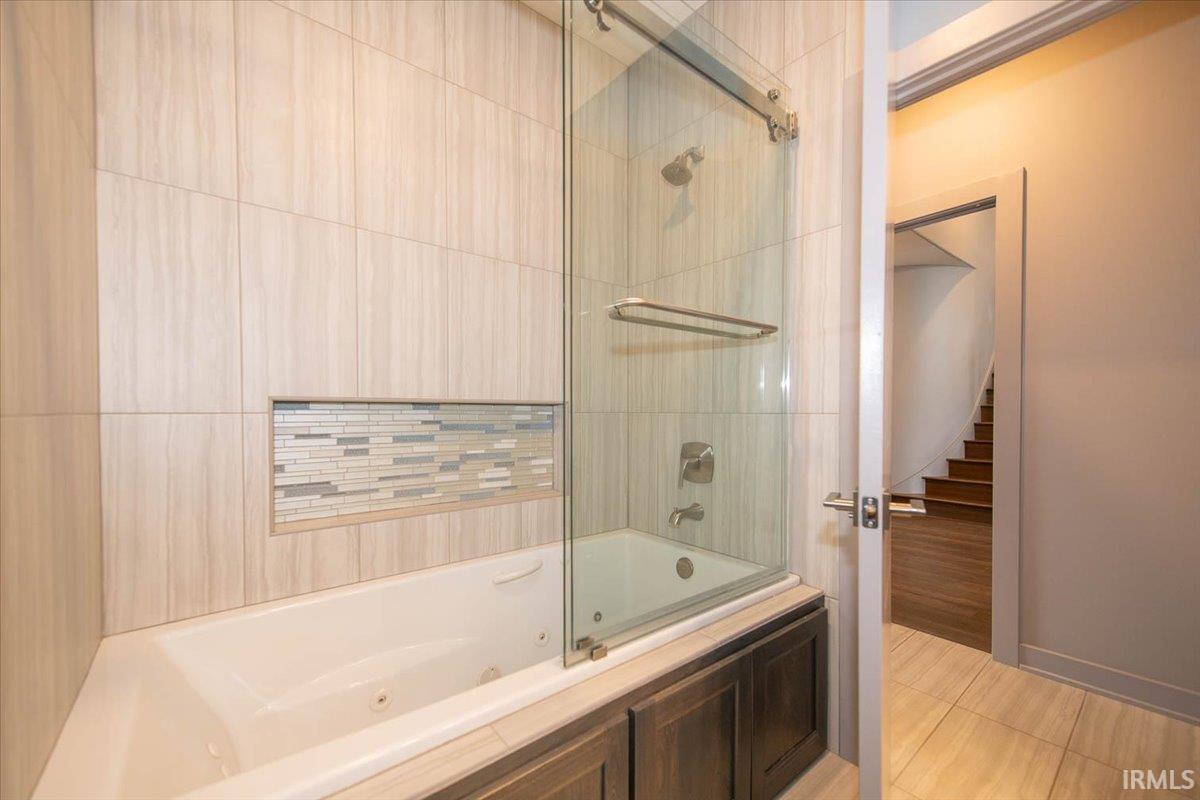 Guest Bath has a deep jetted tub