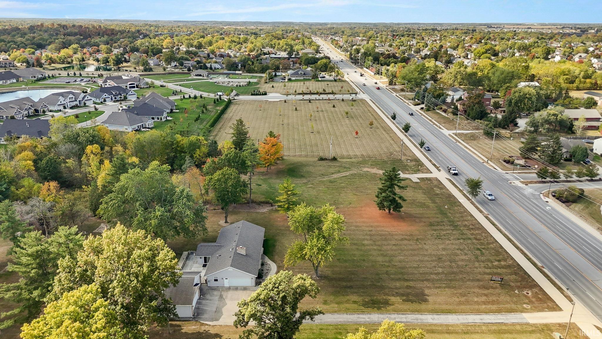 Aerial view of residential area with a tree filled landscape