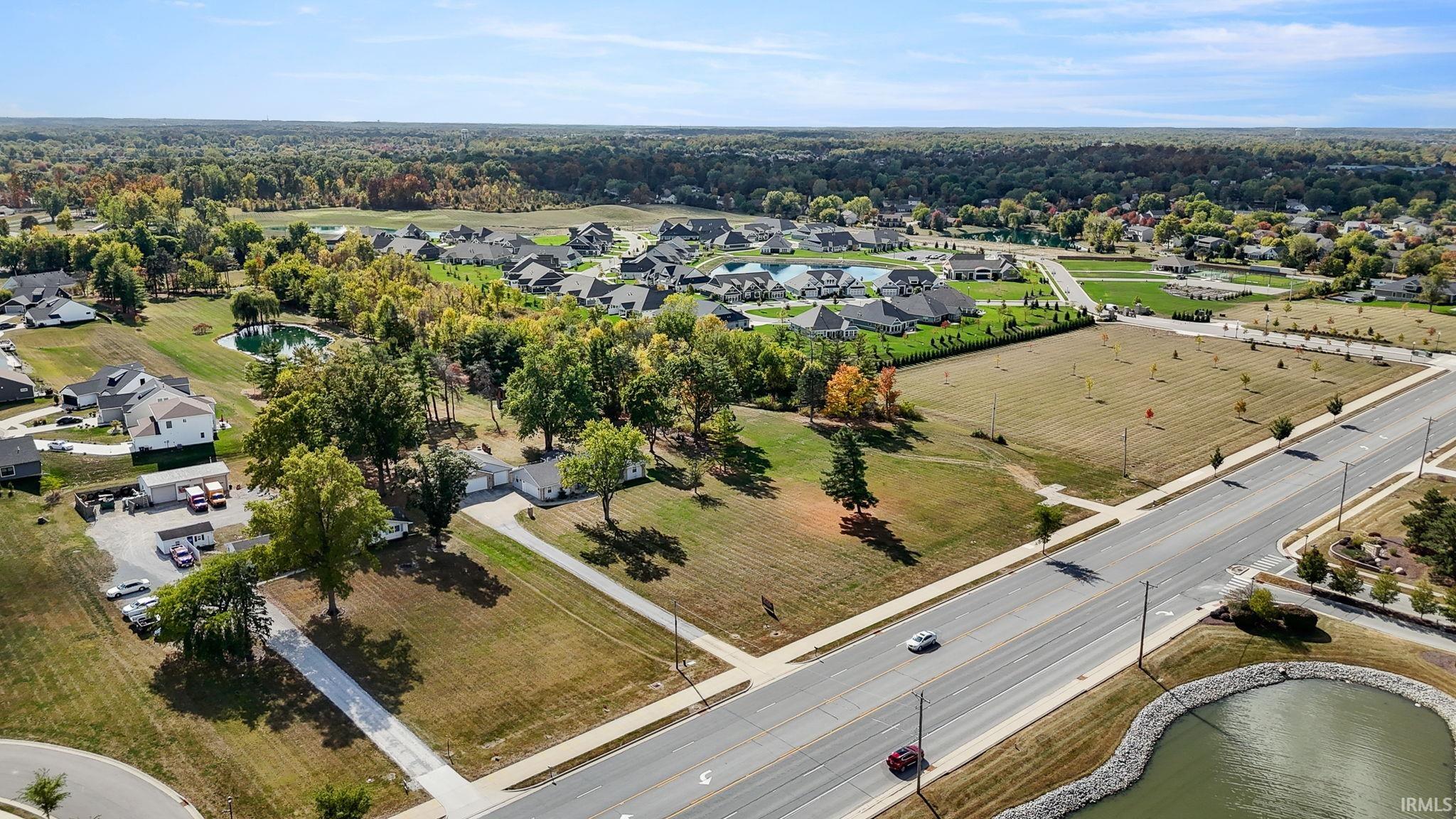 Aerial view of property's location featuring nearby suburban area