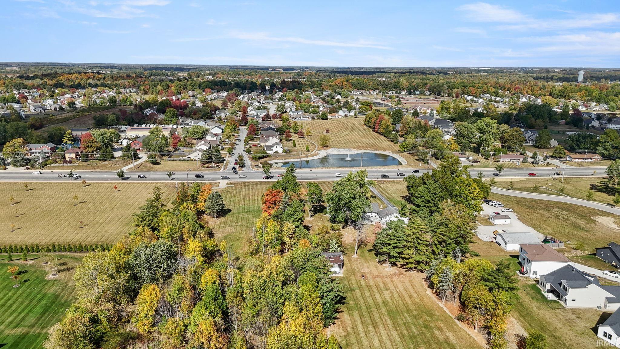 Aerial overview of property's location with nearby suburban area