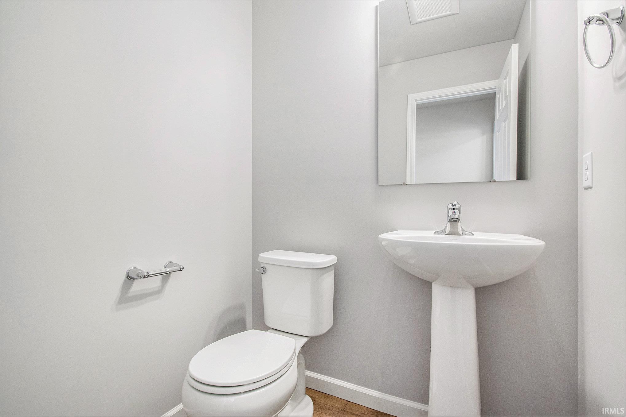 First floor powder room is centrally located and easy for guests to use