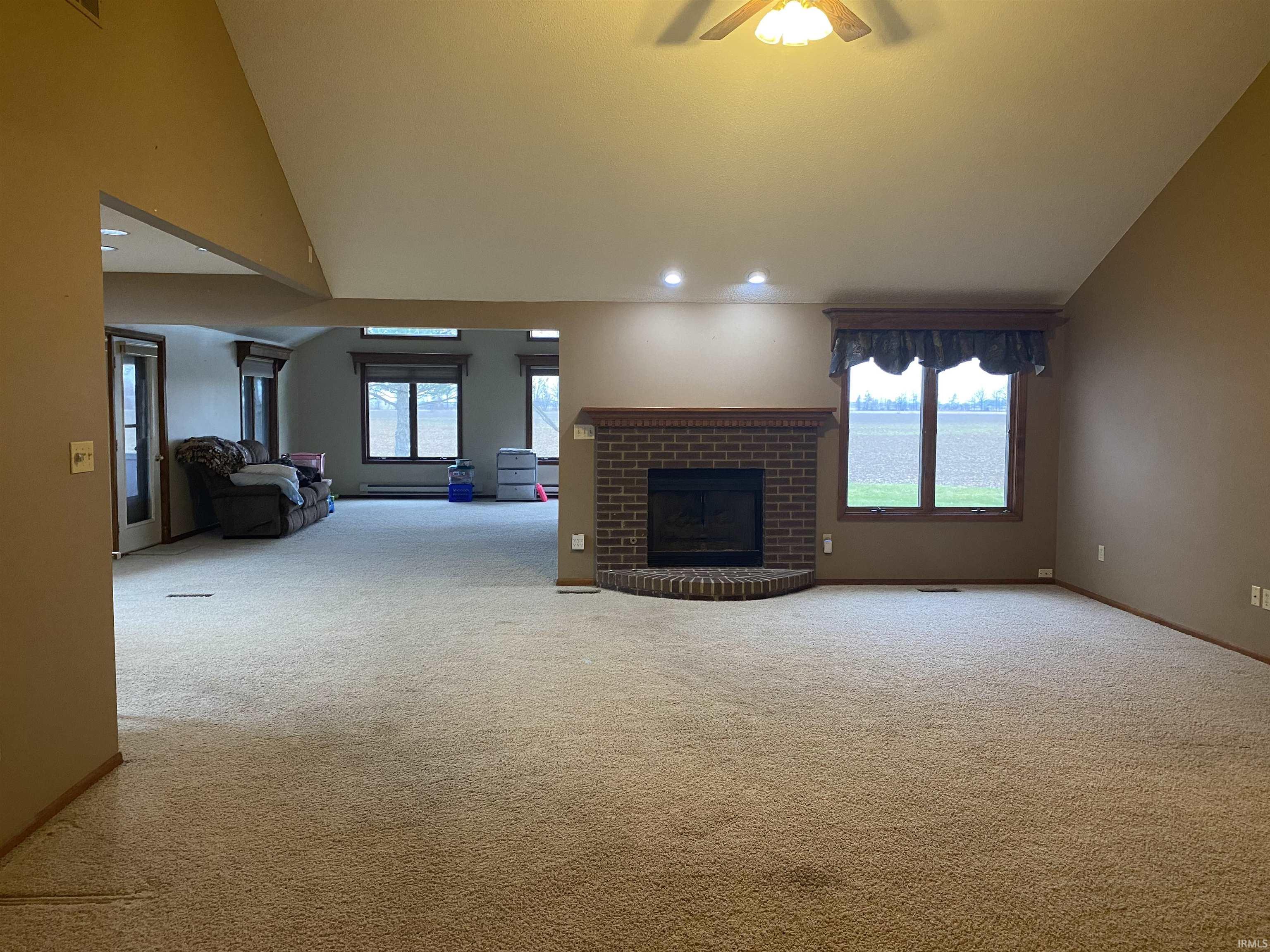 Large open space when entering front door of home. Living room with gas fireplace flows into huge family room, which is ideal for large family gatherings on Holidays and special occasions.