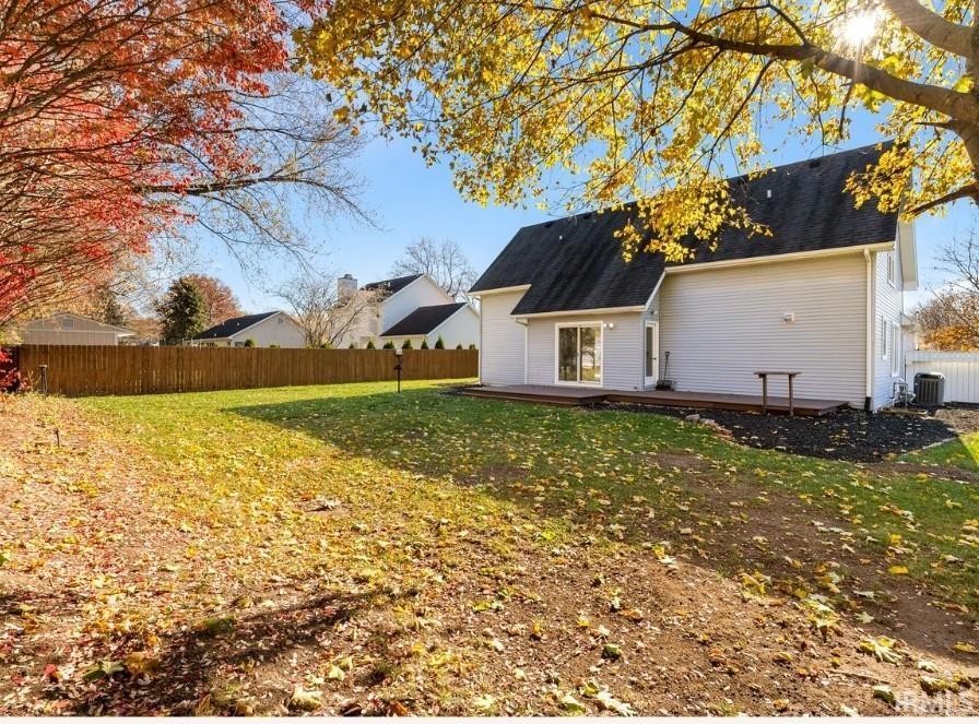 Back of property featuring a wooden deck