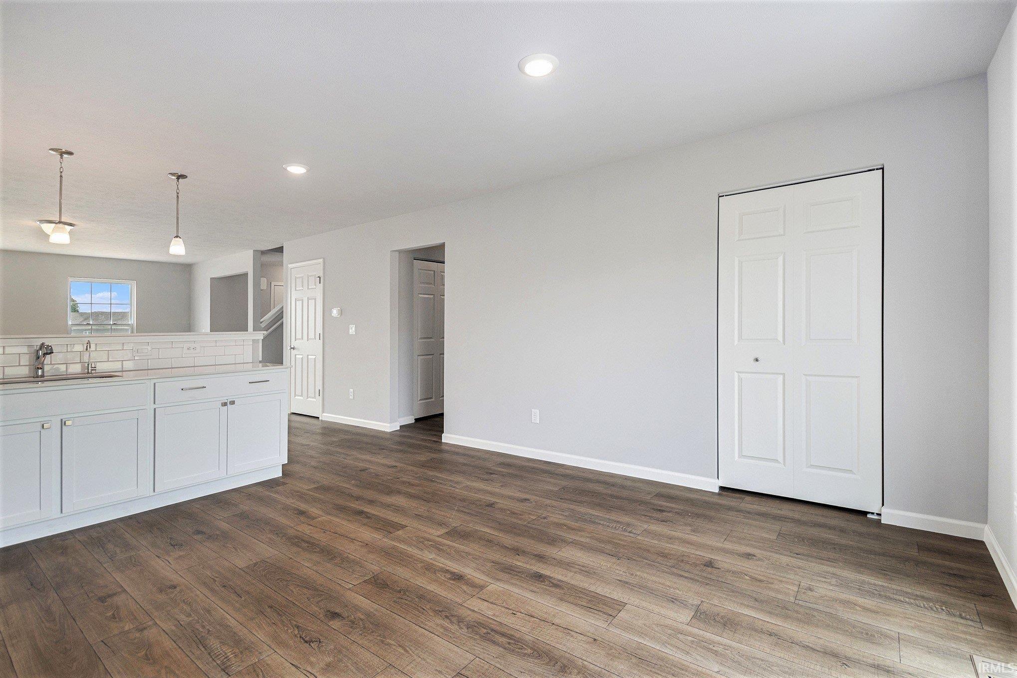 The dining nook can accommodate a large table and has direct access to the rear yard.