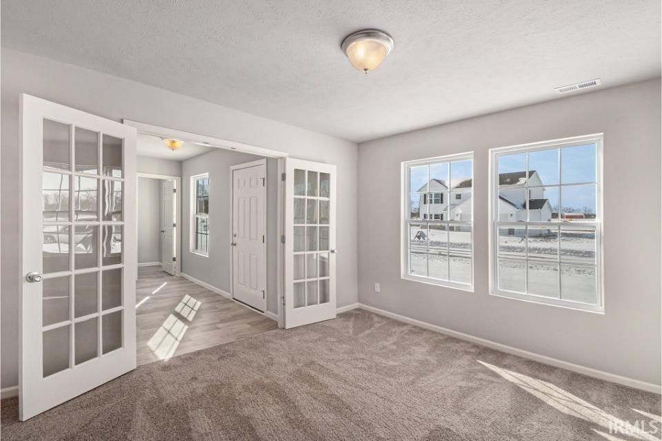The den has ample lighting, French door entry and would make an ideal office or study room.