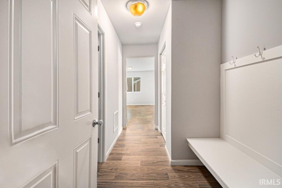 The mudroom includes a large storage close and access to the garage.
