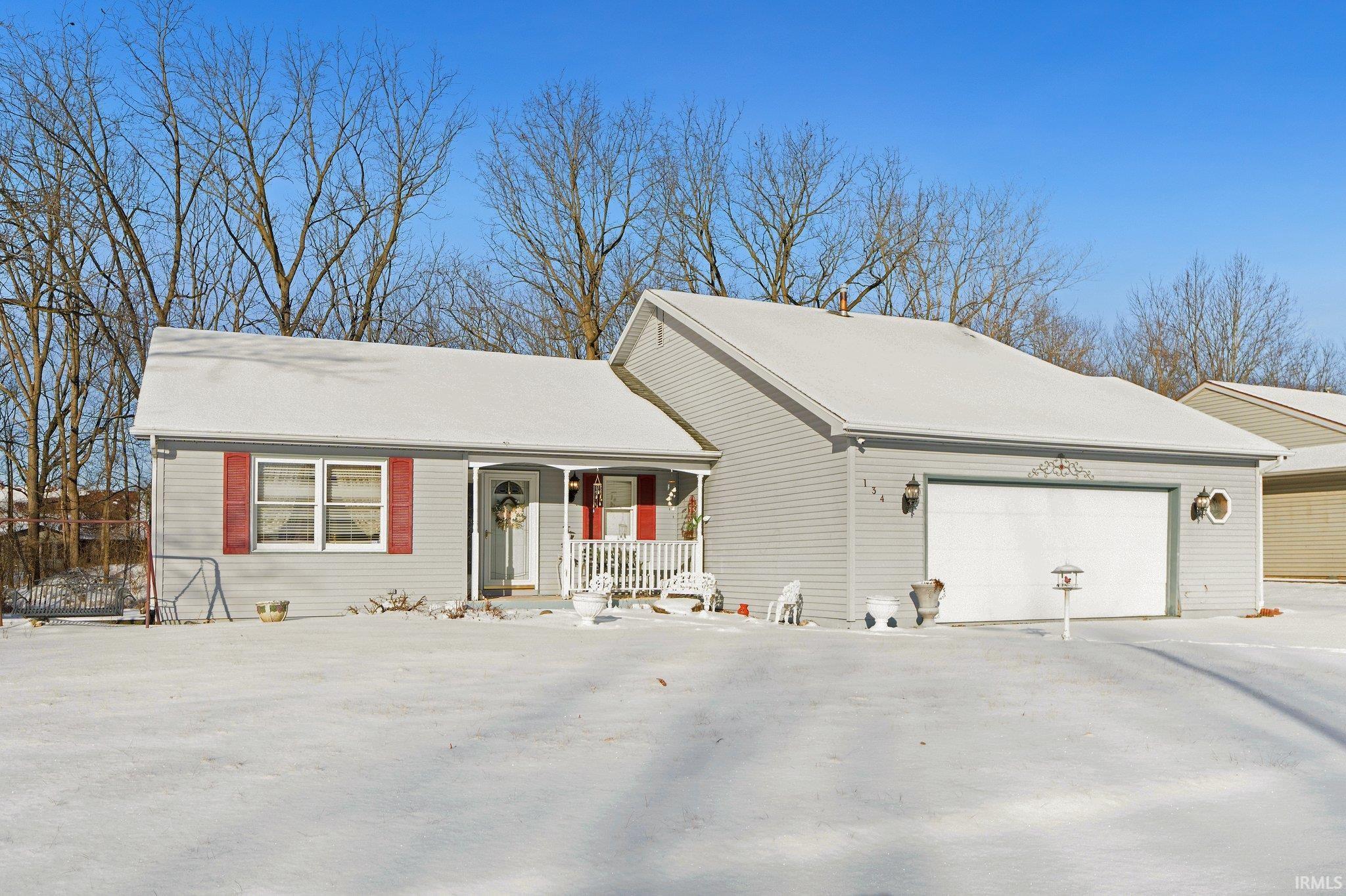 Beautiful 3 bedroom ranch home in desirable Woodlans of Riverbend! Home is situated on a .25 acre lot and bordered by wooded association-owned property meaning no neighbors to the left or behind.  Inside the home is the perfect homey feel welcoming you with cathedral ceilings in the main living room and an open view to family room and dining room. The family room addition offers an amazing second living space with a cozy gas fireplace and sliding door to the backyard. Updates to the home include: 3 year old roof (complete tear off), new carpet in living areas and master bedroom, new flooring in kitchen, 4 year old washer and dryer, and new microwave. Home shows complete pride of ownership as this 2 owner home has been lovingly taken care of and maintained, be sure to check it out!