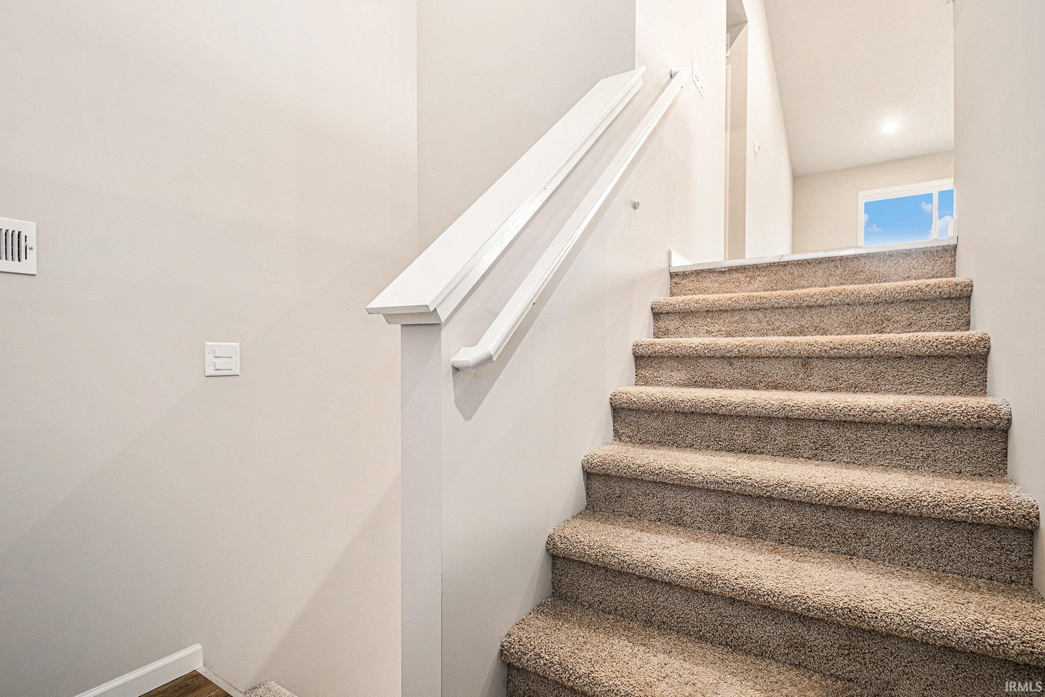 Move In Ready!  This new construction, split level home includes 4 bedrooms, 2 baths, an upper-level great room with vaulted ceilings plus a Rec Room on the lower level.  There is 2,072 sq ft of total living space and several upgraded finishes throughout