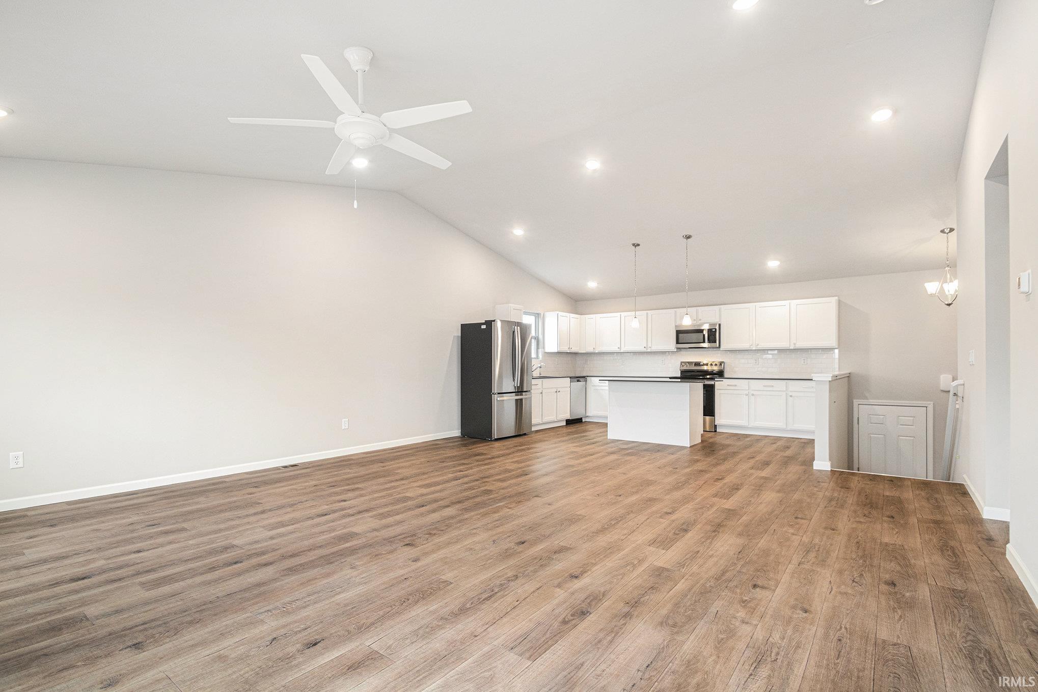 The great room & kitchen feature stunning vaulted ceilings with energy efficient fan and recessed lighting.  The flooring is consistent throughout the great room, kitchen & nook.  Enjoy outdoor dining & entertaining on the 10x10 deck