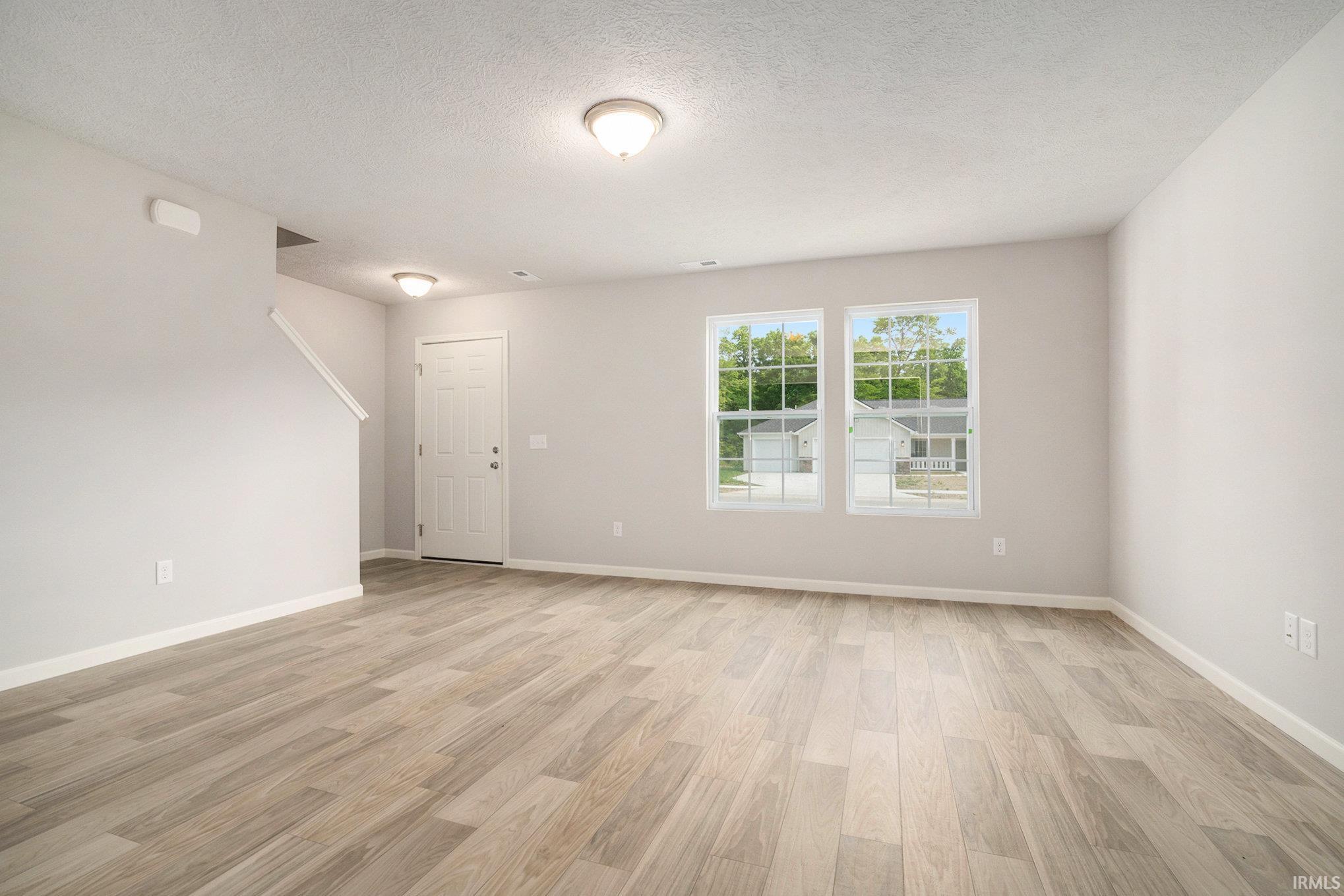 This home welcomes into a spacious great room which features an abundance of natural lighting and consistent flooring throughout the great room, kitchen & nook allowing seamless flow between the rooms.