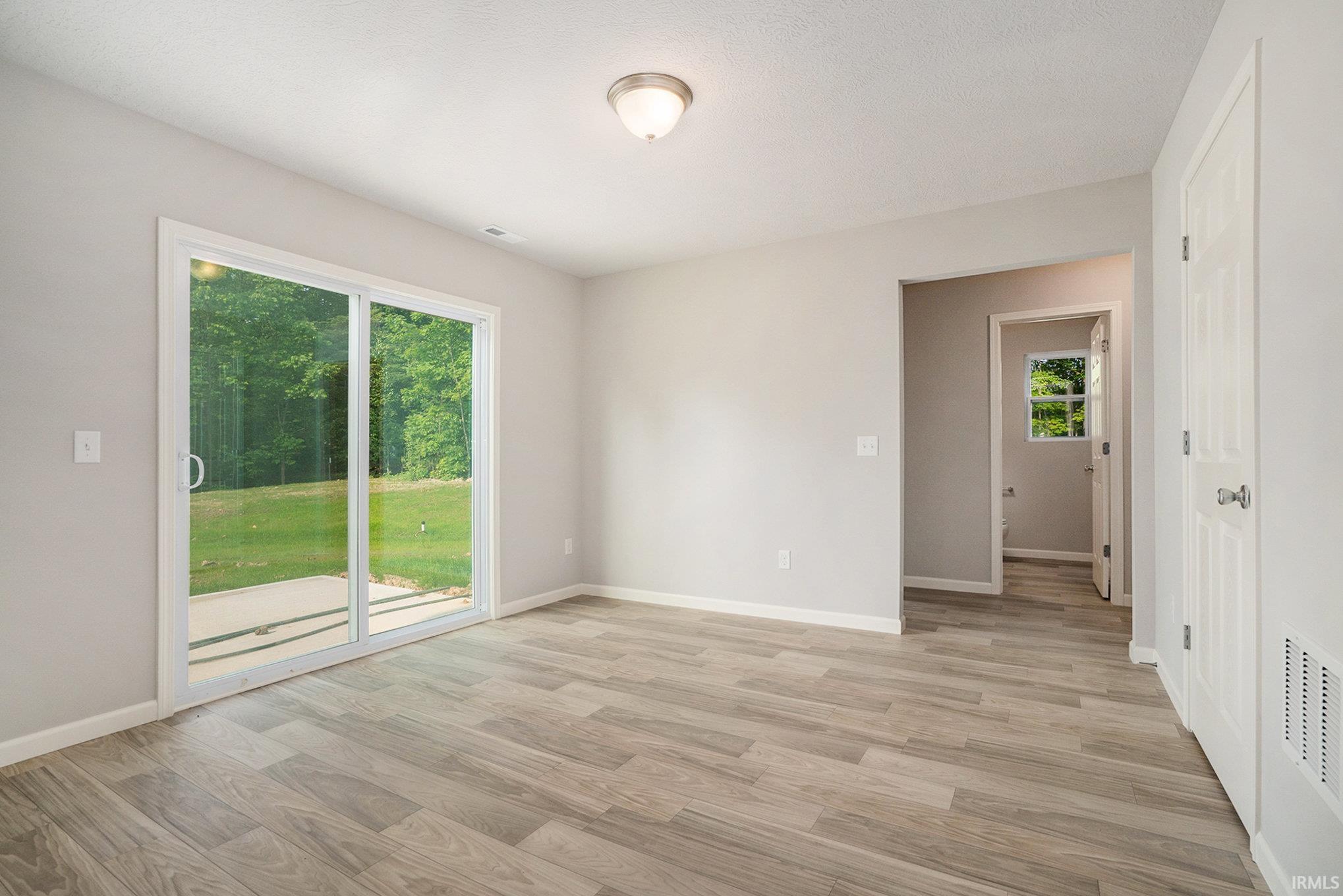 The dining nook can accommodate a large table and has direct access to the back yard.