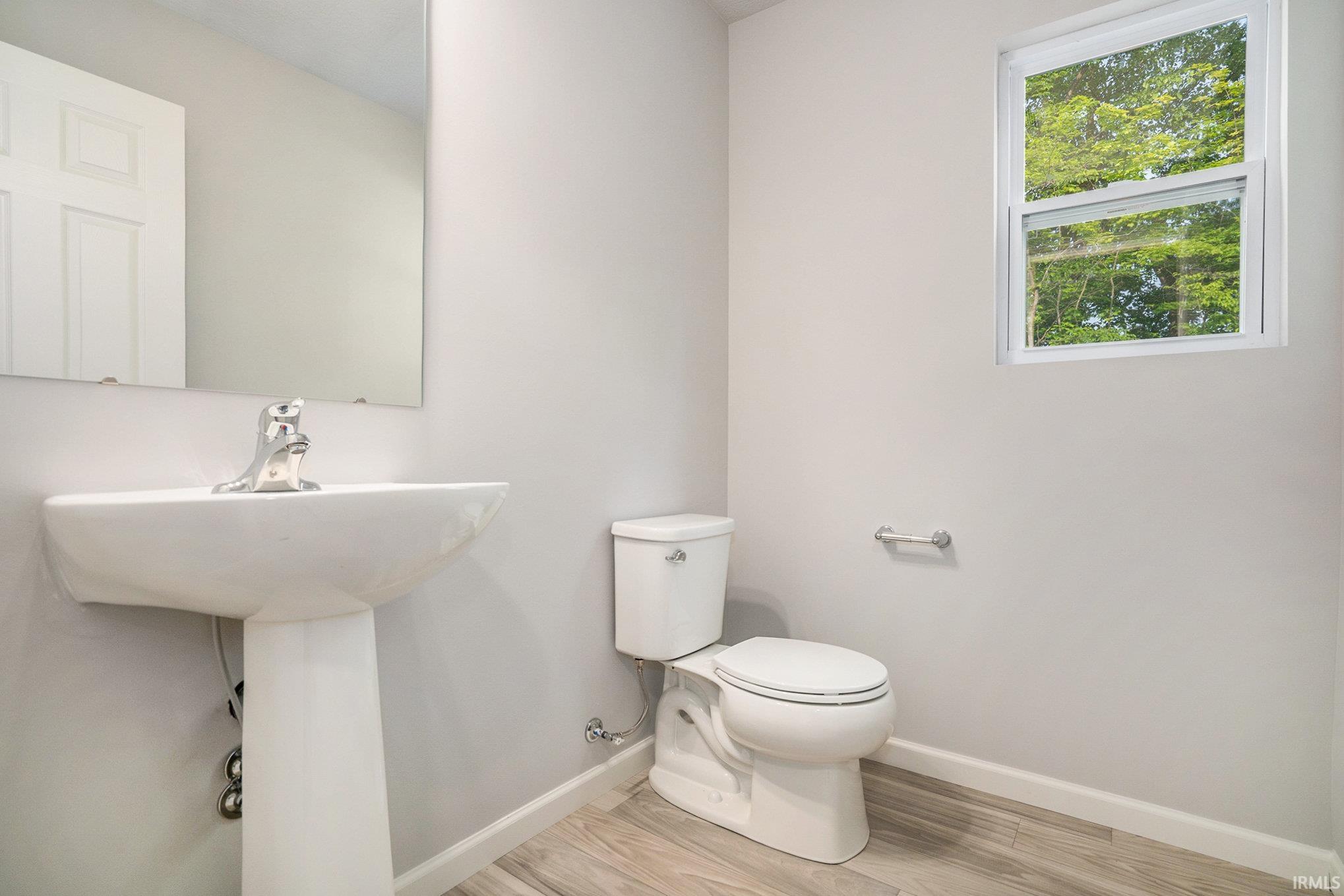 The powder room is conveniently located on the first floor.