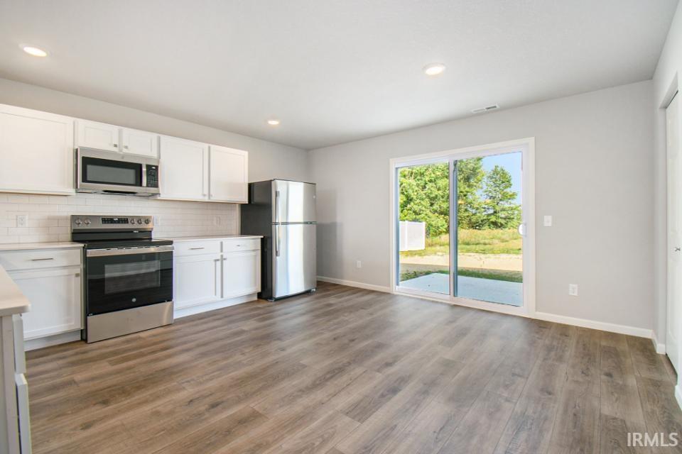 The dedicated dining nook can accommodate a large table and offers access to the rear yard.