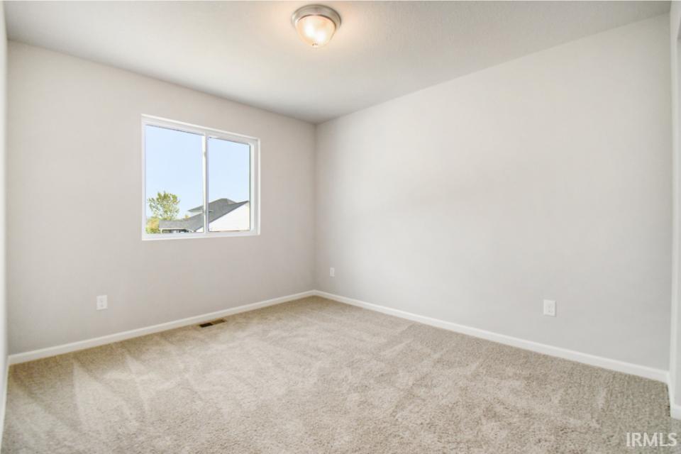 Second floor bedroom 4 features a walk in closet