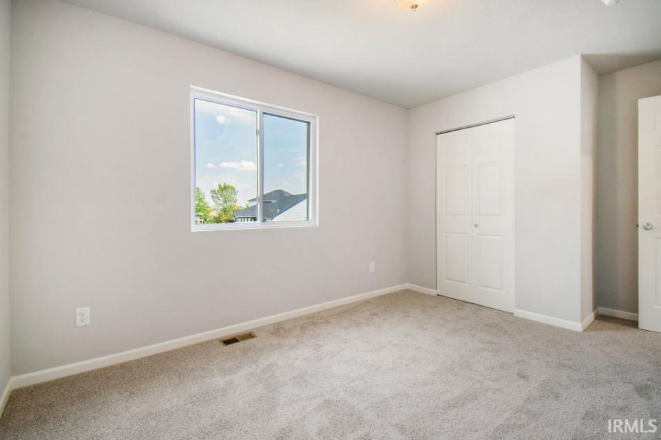 Second floor bedroom 4 features a walk in closet