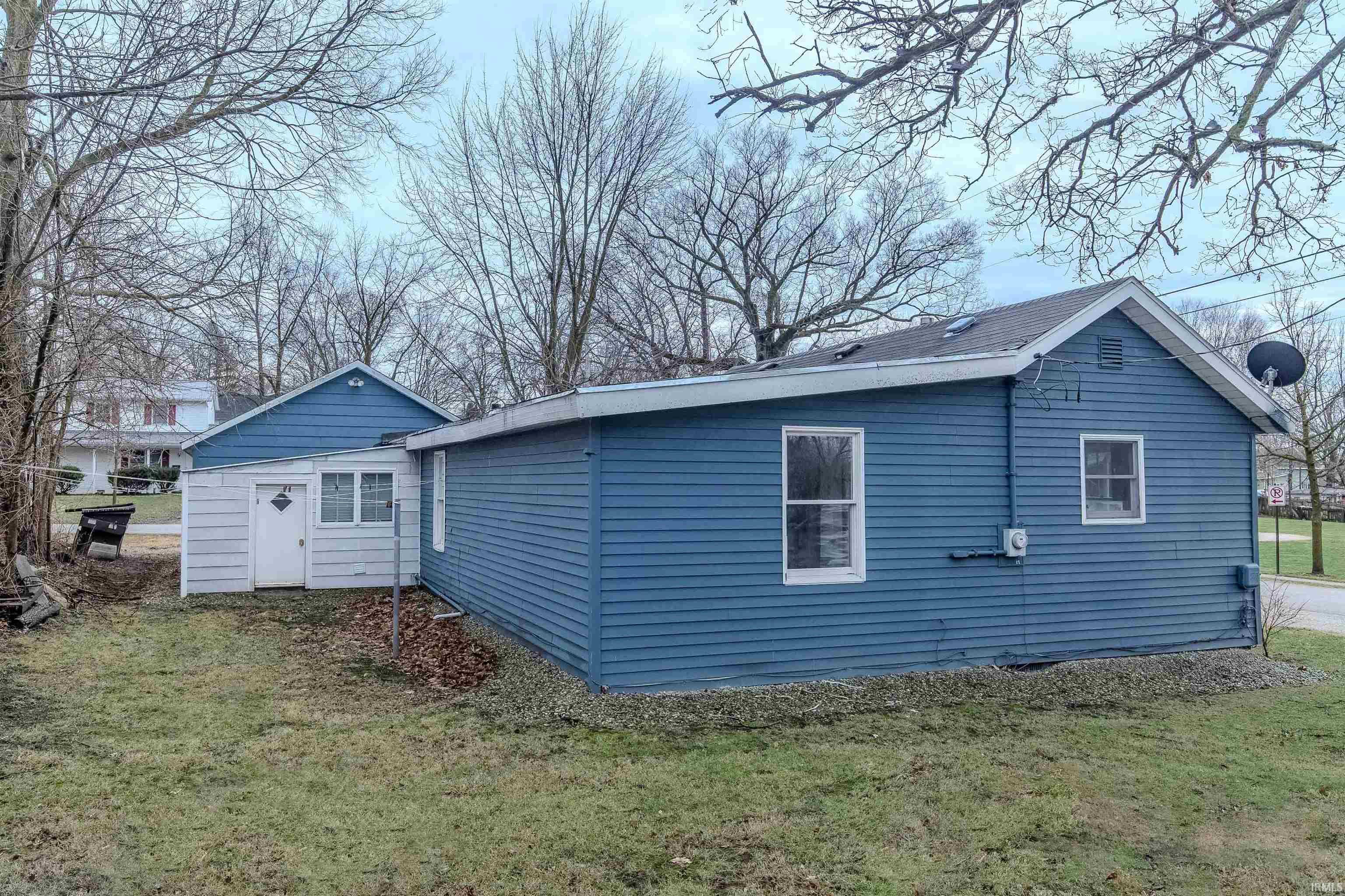 Private backyard with access door to laundry area.