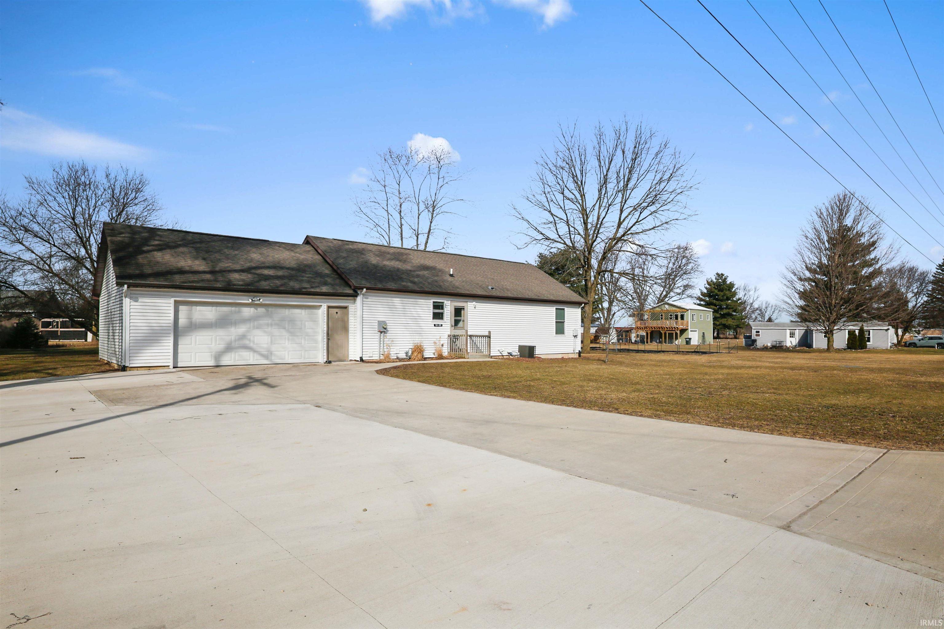 Front view of house with turn around driveway