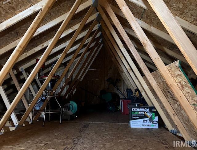 There is an attic ladder in the garage to access this added storage area.