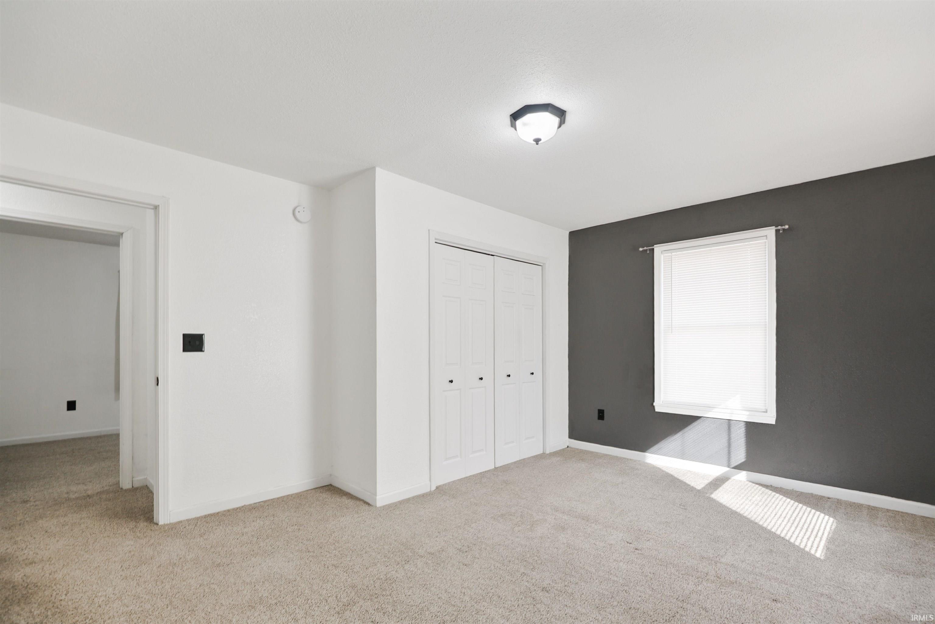 This primary bedroom is attached to the main level bathroom.