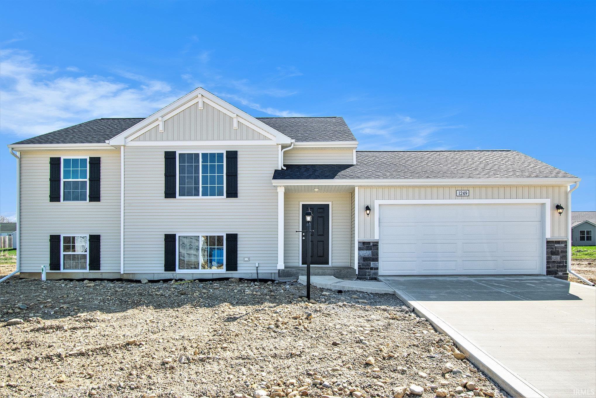 New construction, split level with 4 bedrooms, 2 baths, an upper-level great room with vaulted ceilings, a den plus a spacious rec room on the lower level.  2,192 sq ft of total living space and upgraded finishes throughout.