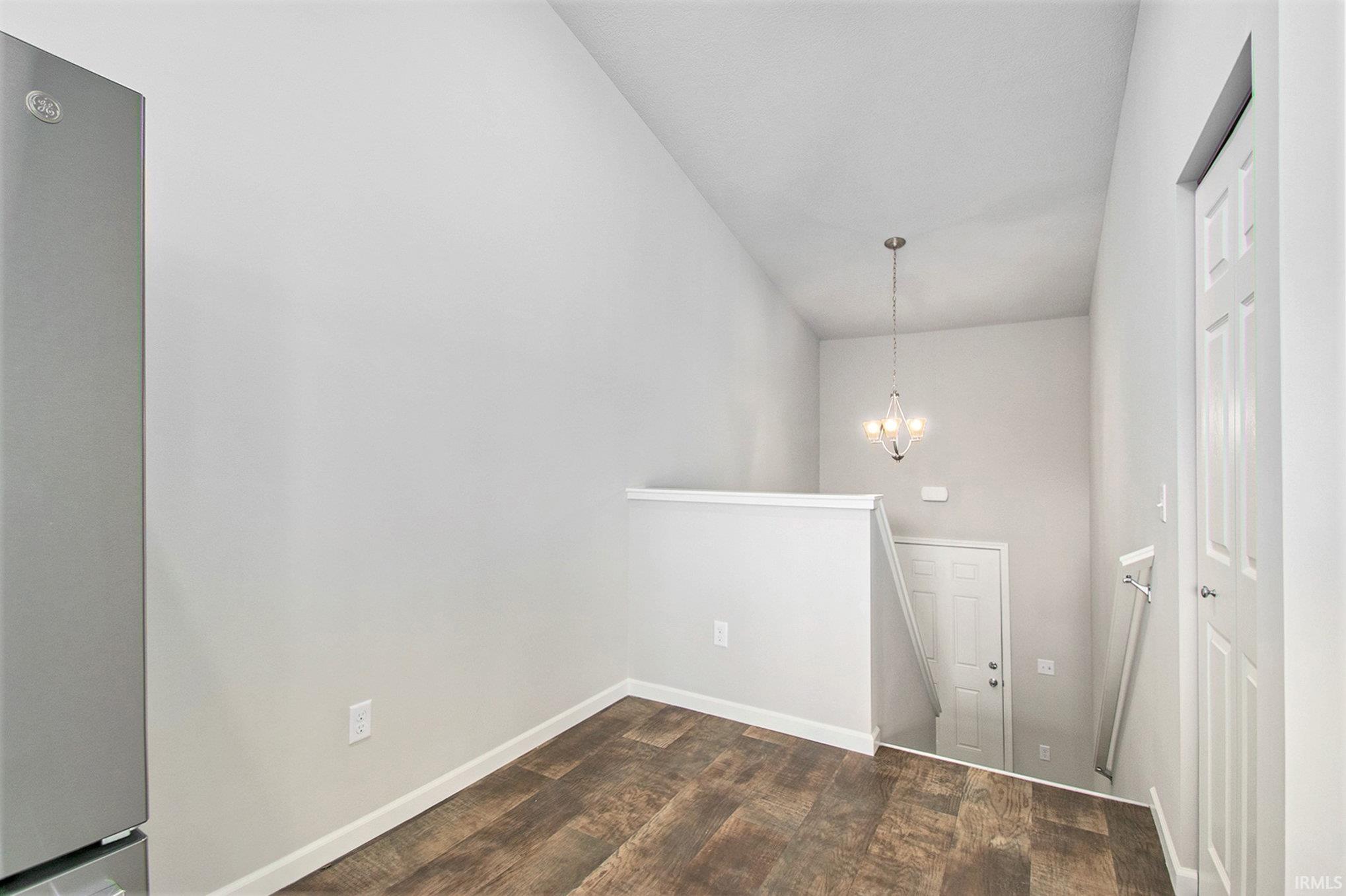 Upper-level great room with vaulted ceilings, plus a den which is ideal for a home office.  The primary suite is also located on the upper level.