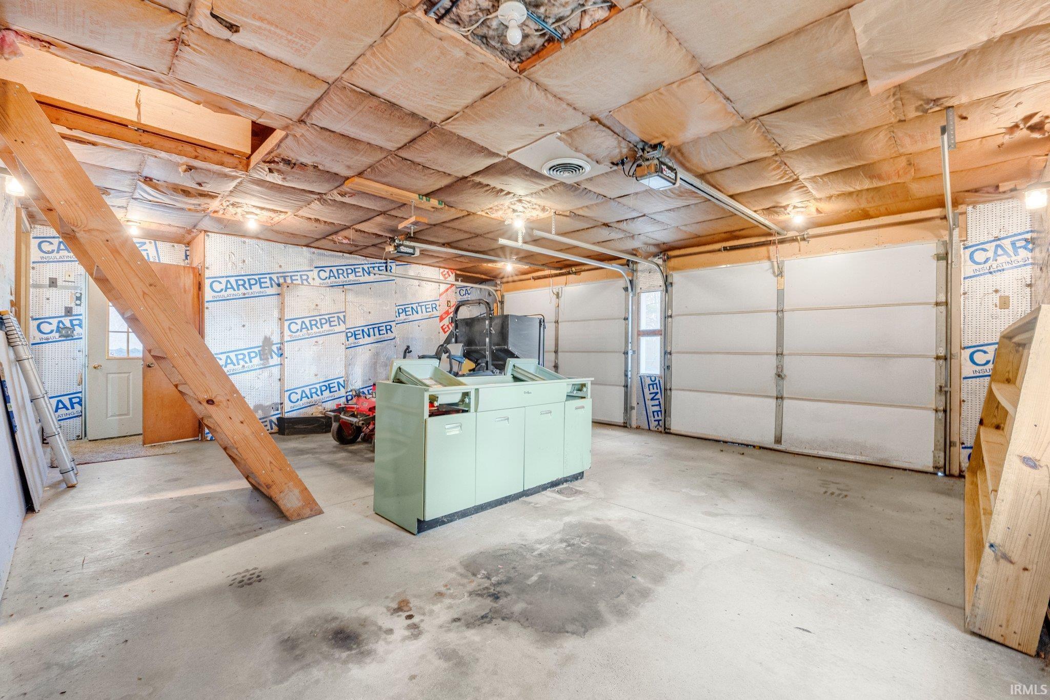 The garage also includes a large air compressor for blowing up lake toys or working on them.