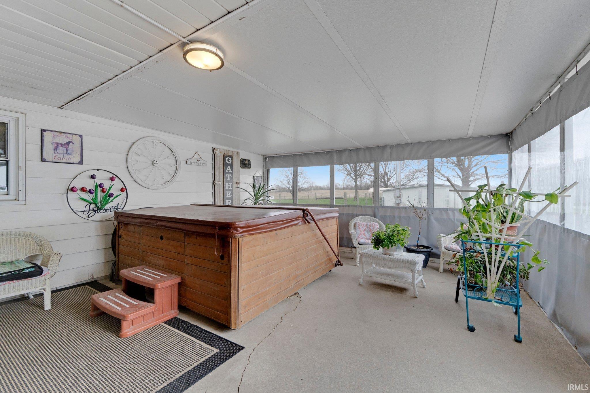 Sides can be lifted for warmer weather. You can enter the garage or the living room from here.