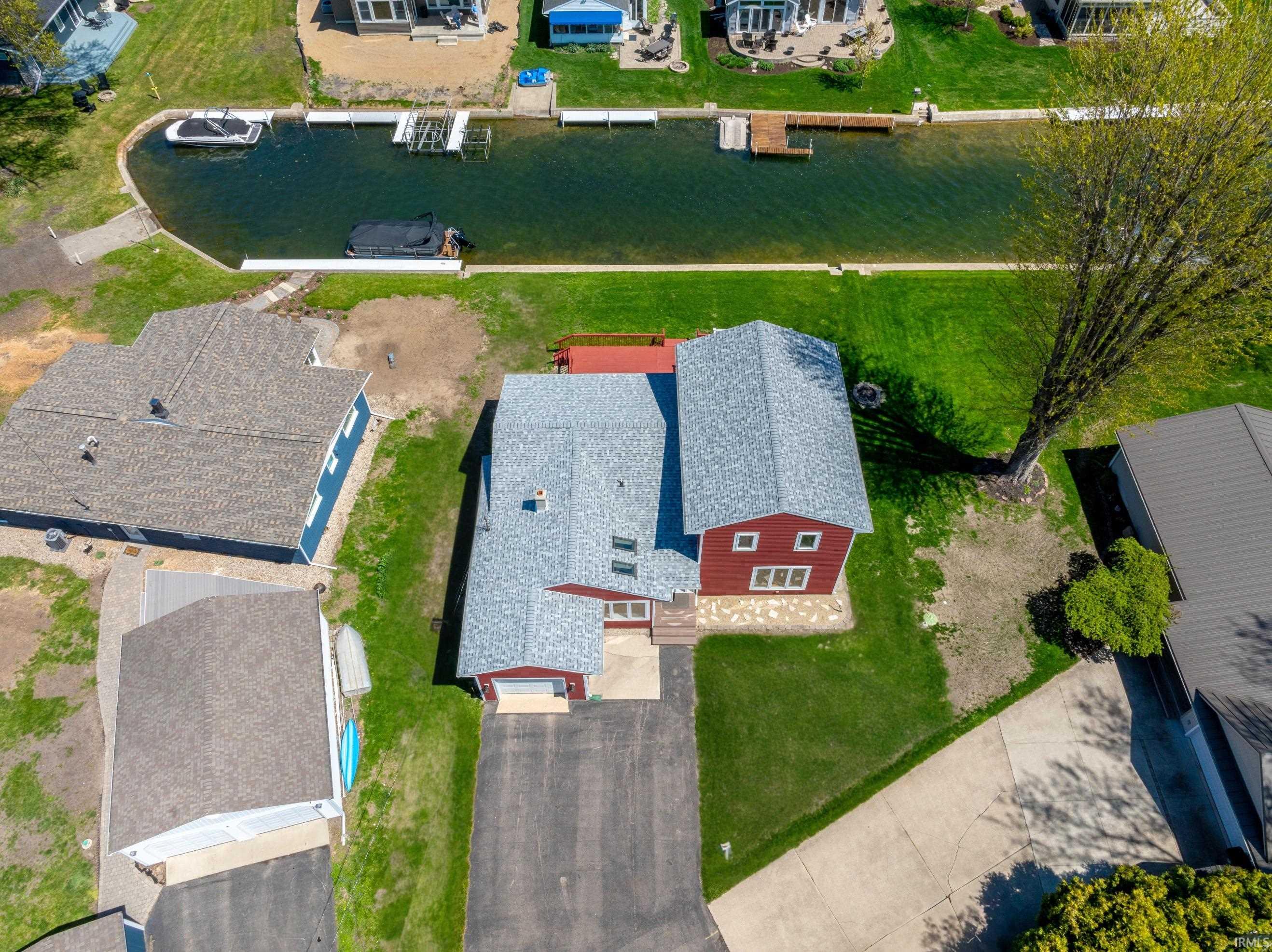 Lawn has been seeded after sewer hookup. Photos have been altered to show future grass growth.
