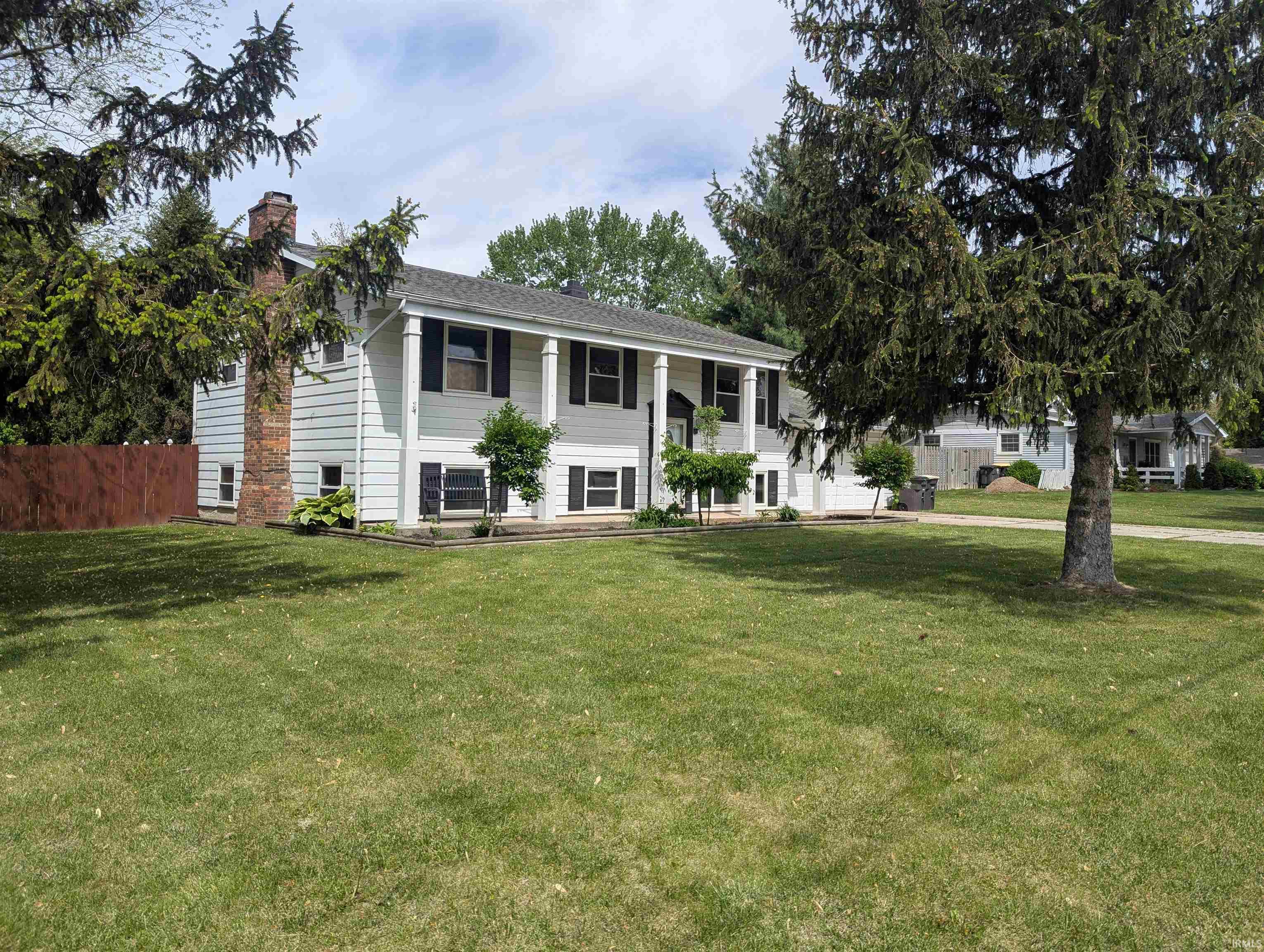 Don't miss your chance to own this charming bi-level home, sitting on nearly 1/2 acre lot, encompassed in a newly stained, wooden fence. This home features 4 bedrooms, 1 1/2 baths, large family room/rec room on the lower level, and tons of natural lighting. Both bathrooms have been updated and the Lower level has all newer flooring, paint, and lighting. The large yard features garden space, mature trees, and a well maintained storage shed with attic space.