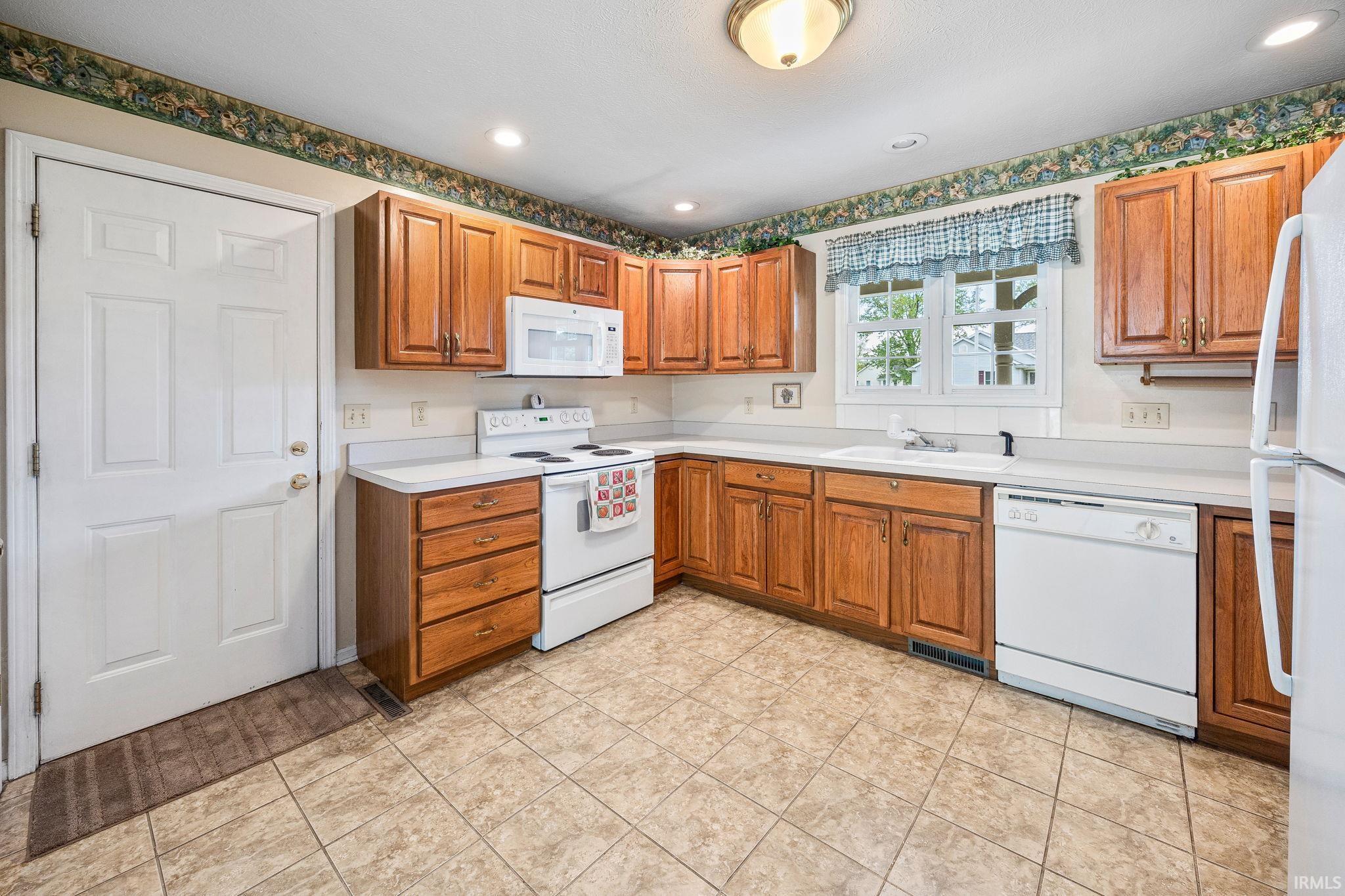 Neutral Countertop and Tile Flooring