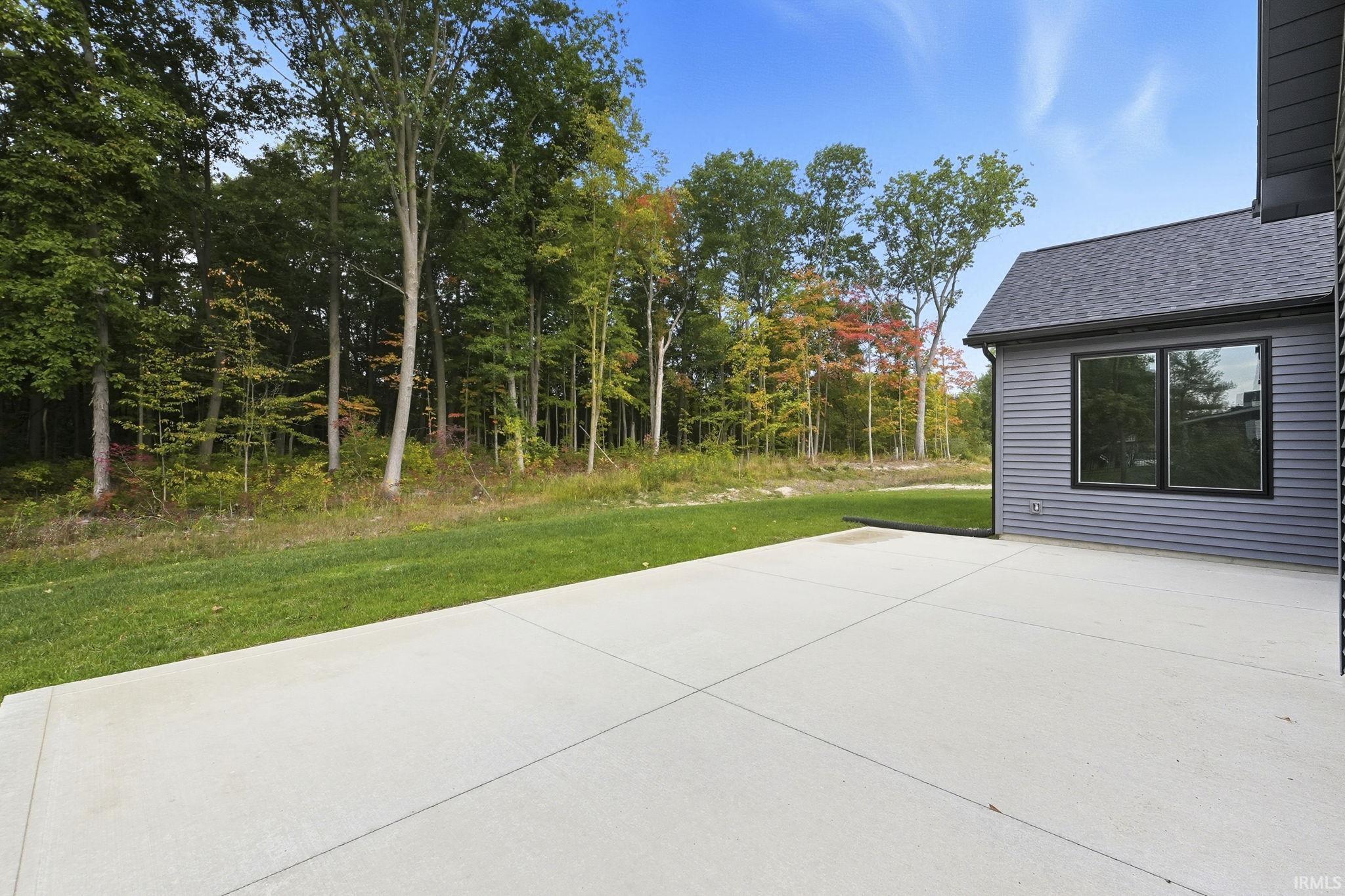 30x16 Patio with views of the wooded backdrop on two sides! Enjoy entertaining your Guests w/a gas line plumbed for your own gas grill.  Plenty of space for your Hot tub or any extras you want to add! The views are unbelievable!