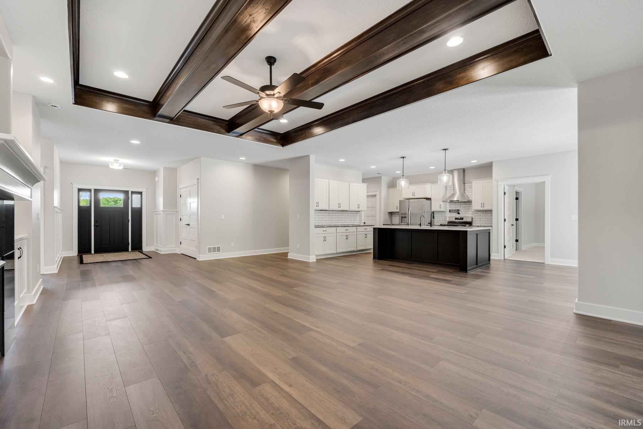 Imagine your furnishings in this amazing living room! Poplar trim and beams add to the warmth of this Craftsman Style Beauty!