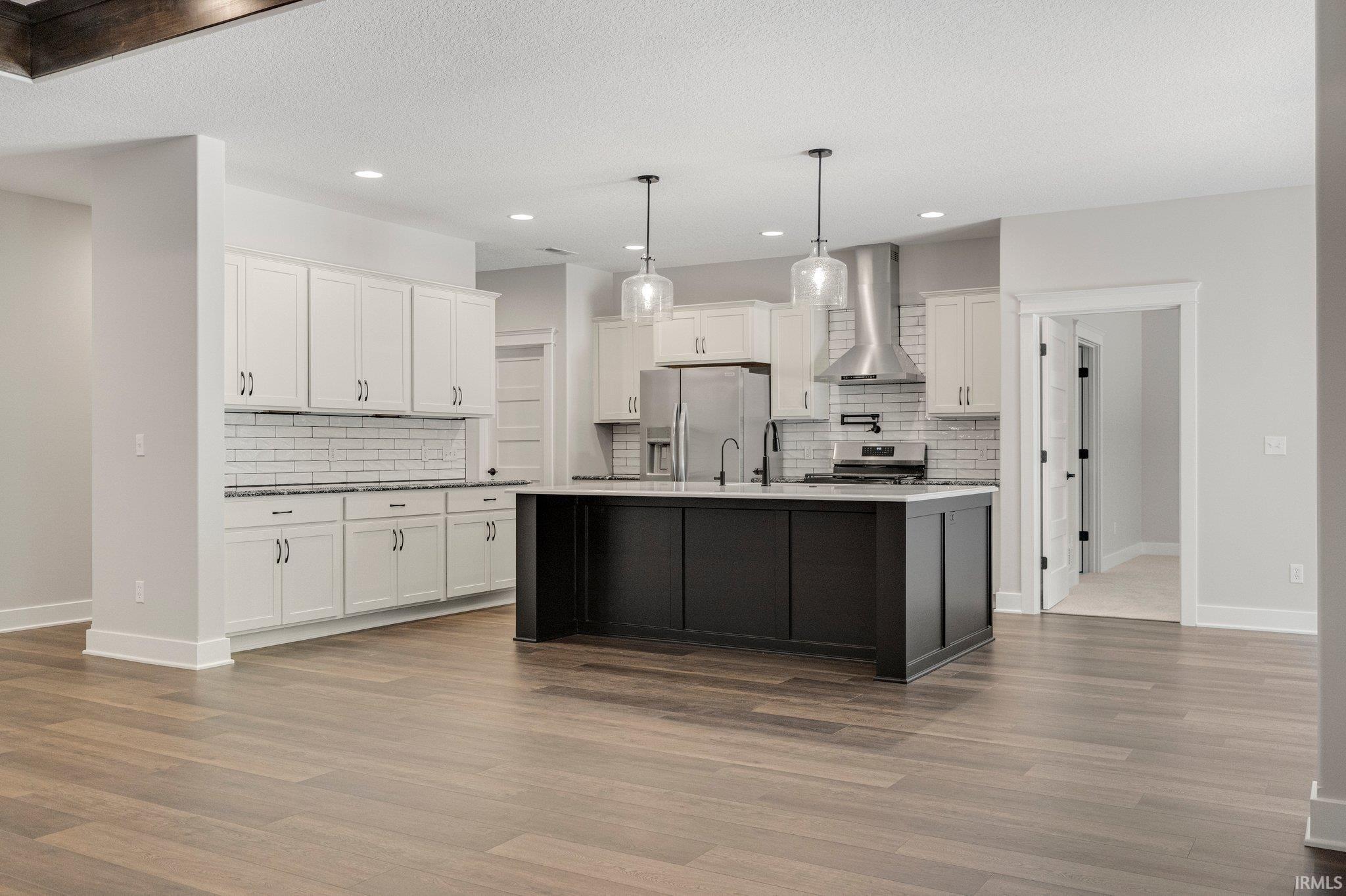Entertain your guests w/the 8 Ft Quartz Island, plenty of storage in this stunning kitchen w/Granite & Quartz Countertops w/ceramic tile backsplash. 36