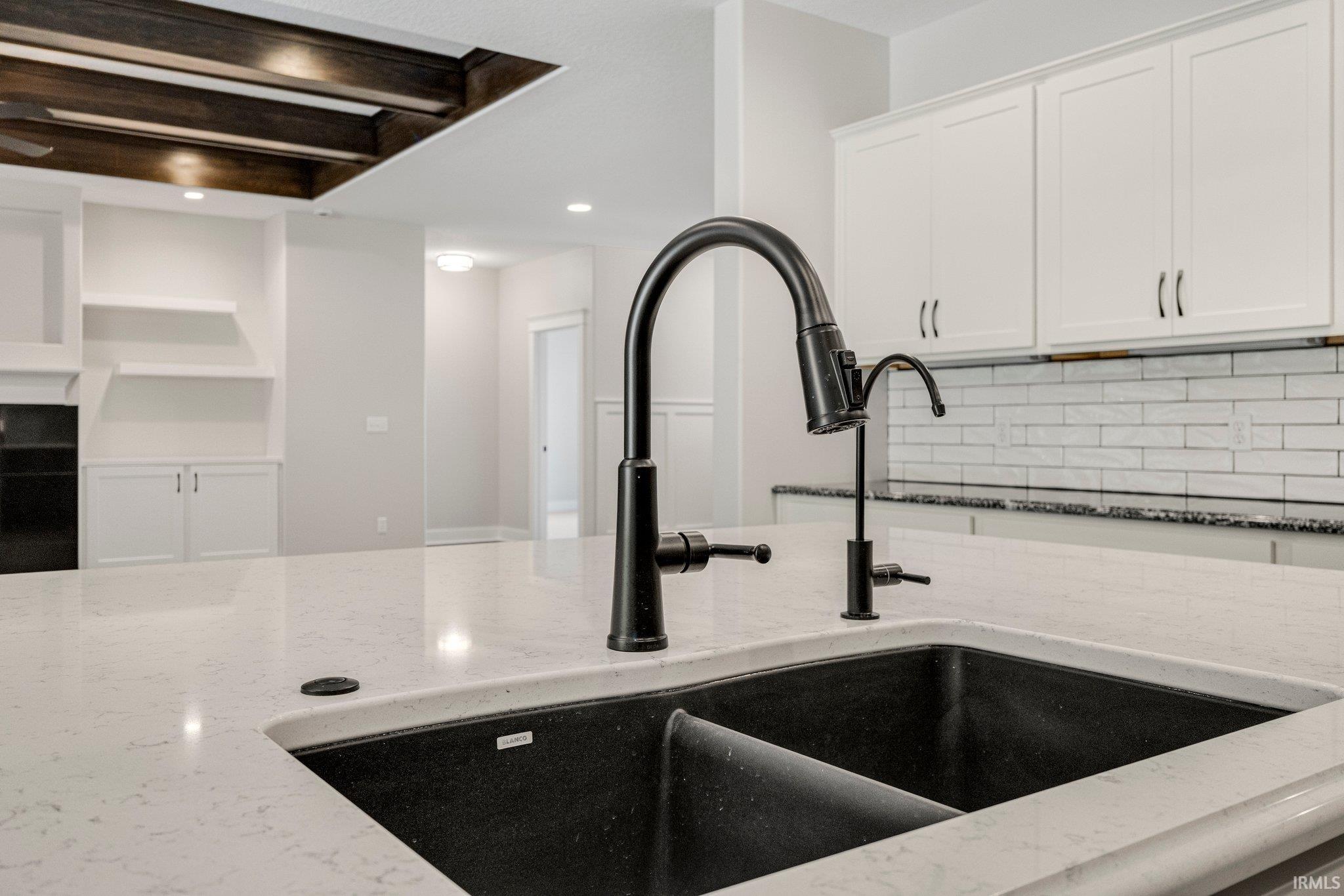 Kitchen plumbed w/R/O for your system to be installed. Delta Faucets throughout. Pot Filler faucet above stove too!