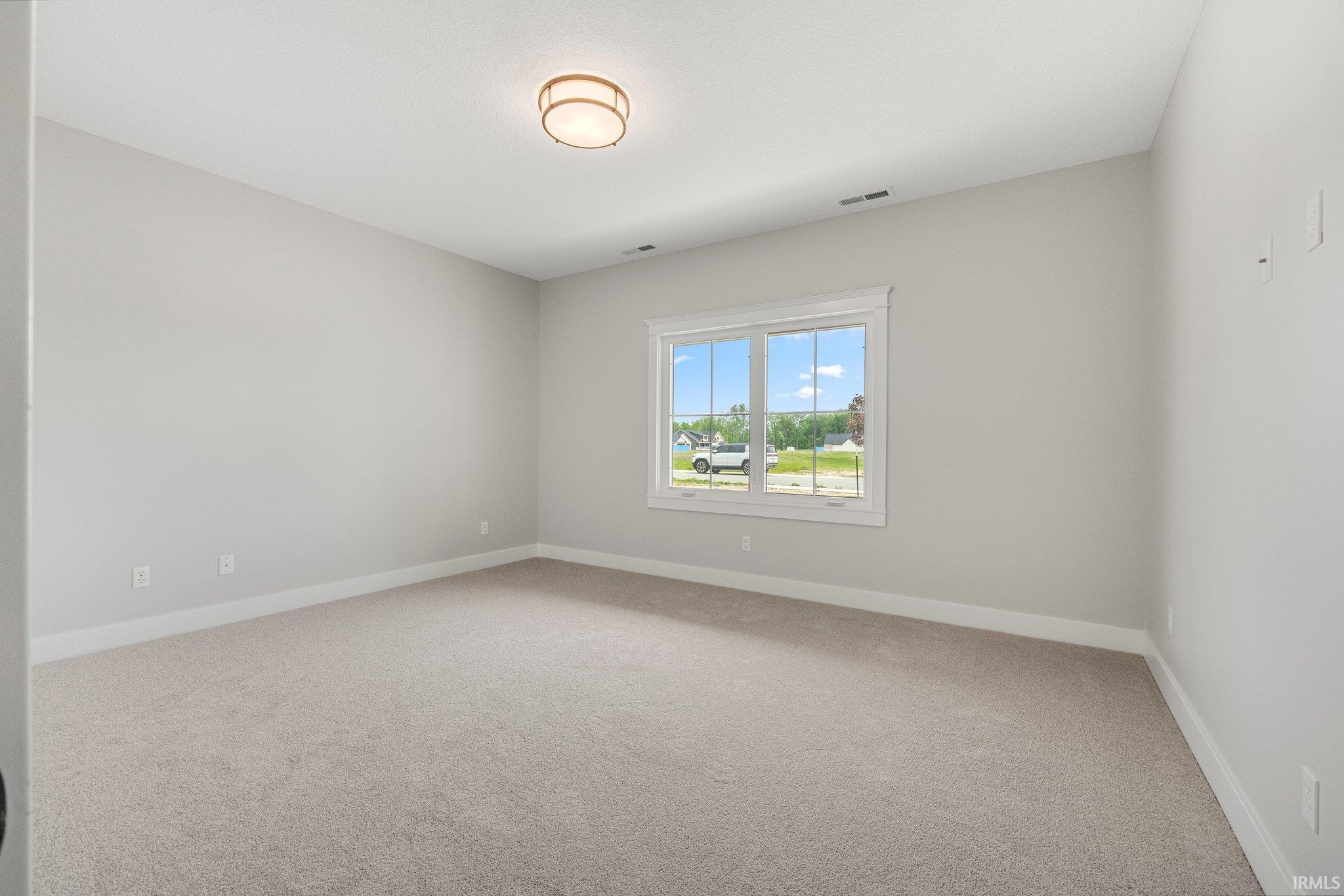 Bedroom 2 front facing overlooking the start of the pond across the street. Wired with CAT 5 for great home office. All Bedrooms, Sunroom & Living Room are wired for internet.