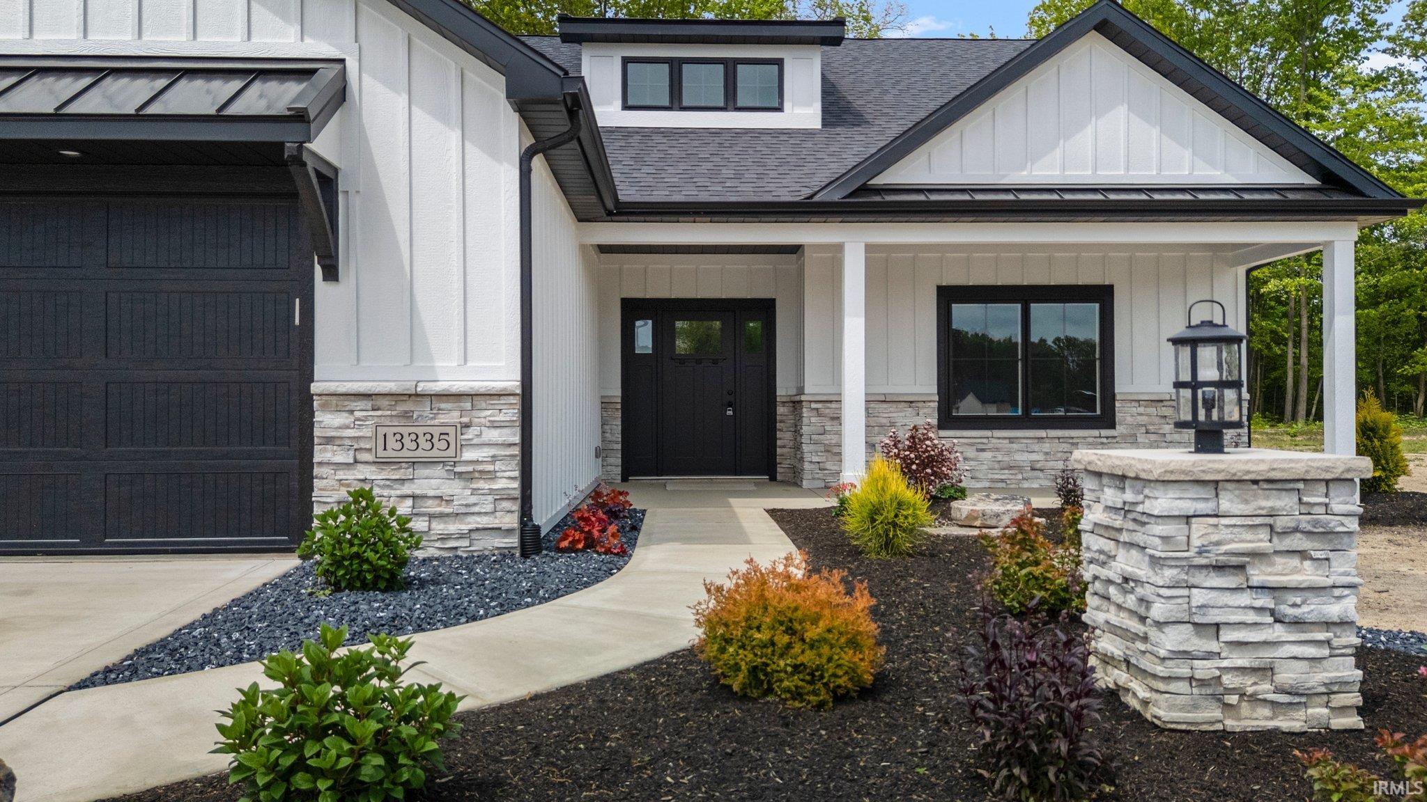 This home has it all! From the Brick light post to the covered front porch, every detail was well thought out in this custom craftsman style home! The professional landscape greats you as you enter this beauty!