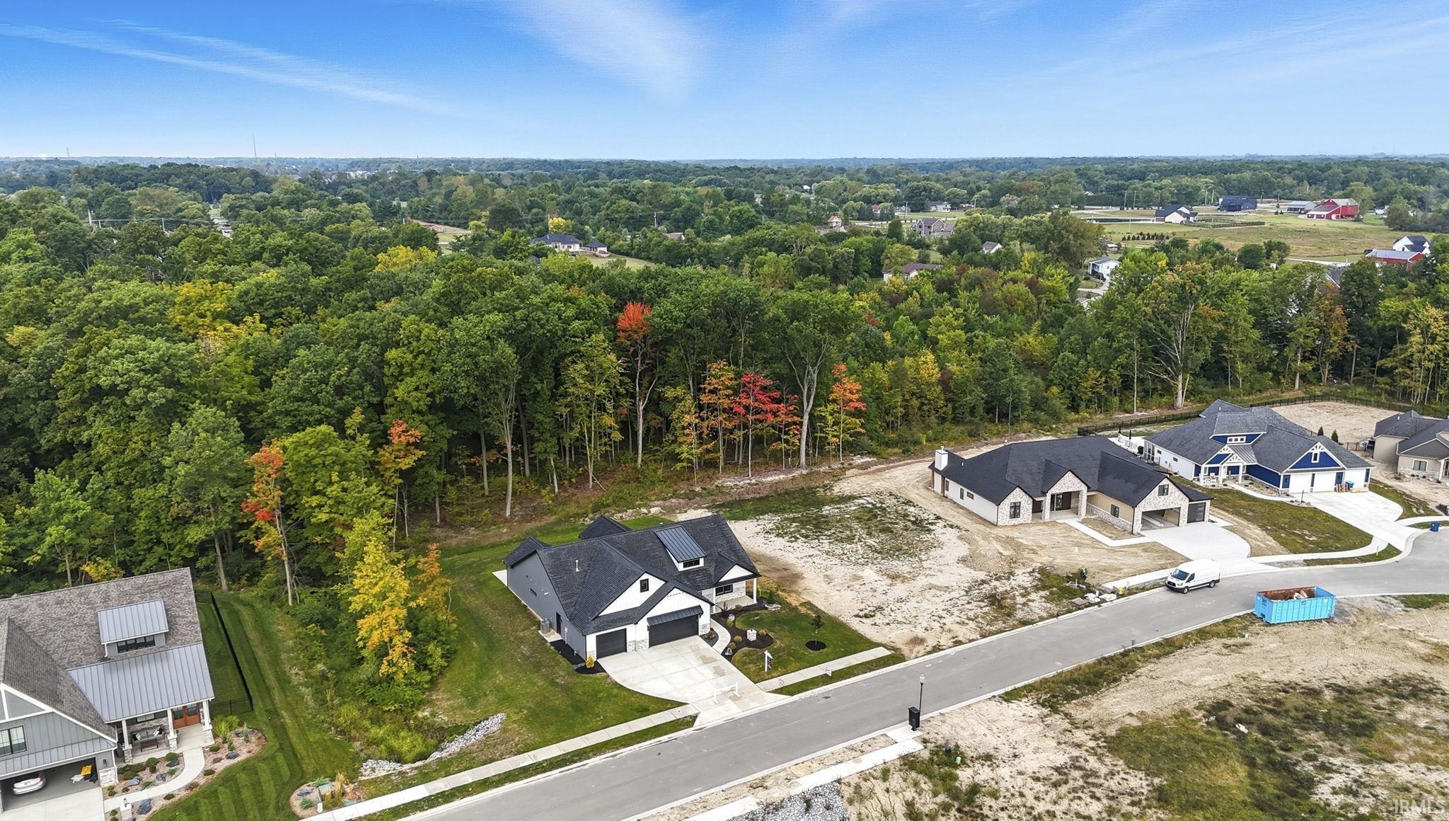 Aerial view of the nature all around on this one of a kind lot!