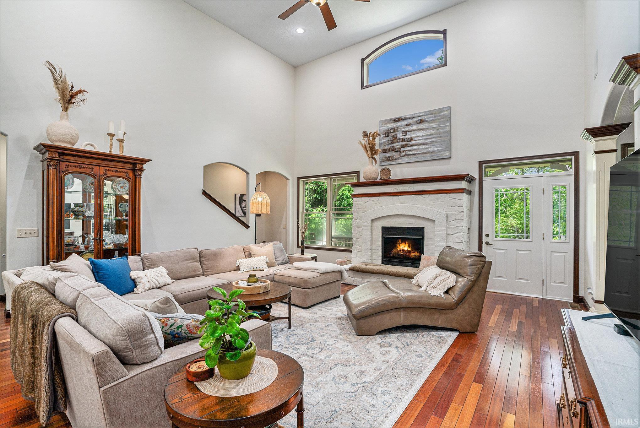 18' Ceiling, Brazilian Hardwood Floors, Open to Dining Room & Eat-In Kitchen, & Gas Fireplace