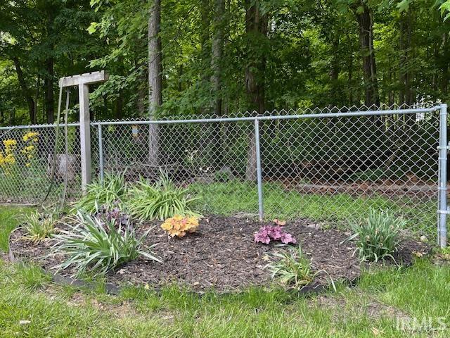 Backyard Flower Garden. Cloths Line, Chain-link Fence