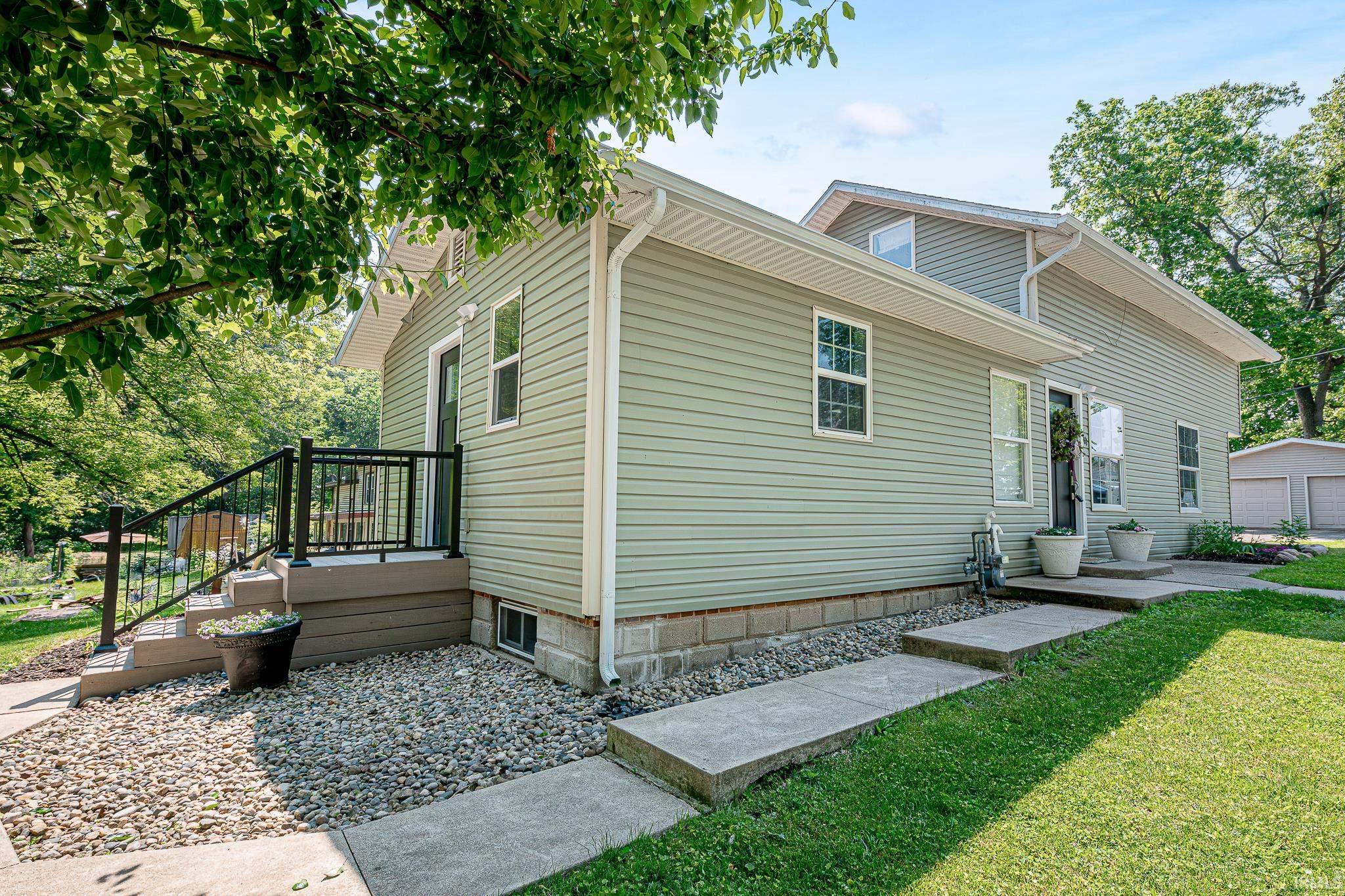 Adorable move in ready home just off of Sylvan lake! Whether you’re looking for a year round home or lake cottage, this home is perfect for either option. The moment you walk in you’ll love the open concept floor plan with natural light and modern upgrades. The kitchen features updated cabinets with gold hardware, tile backsplash, new single basin sink, board and batten accent wall, nice sized pantry, and stainless steel appliances. There is plenty of space for a dining room table and a cozy living area. The main level also offers a full bath that’s been completely updated, and a spacious primary suite with attached half bath that’s been updated as well.  The additional bedrooms are located upstairs and are big enough for multiple beds if needed! There is also a partial basement with small finished area for laundry, and an unfinished area for mechanicals and storage.  Additional updates to highlight include: new laminate flooring all through out, new trim, new outlets & switches, new 6 panel doors, new exterior doors, new lighting, and new full size closet in upstairs bedroom. Outside offers low maintenance yard, off street parking, and utility shed. This home does not have lake access but is walking distance to Sylvan Lake, a 669 acre all sports lake great for skiing and fishing. This home has so much to offer be sure to check it out.