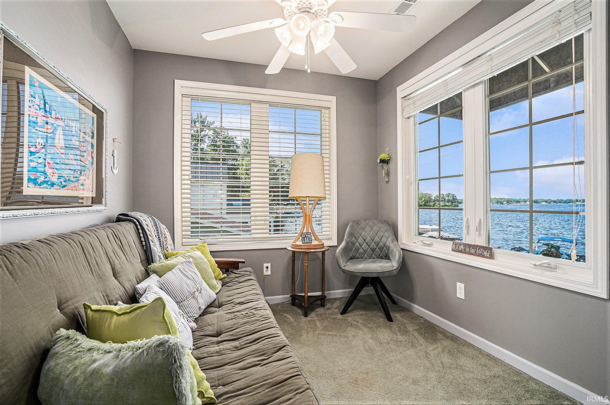 Enjoy the lake in this cozy area of the bedroom.