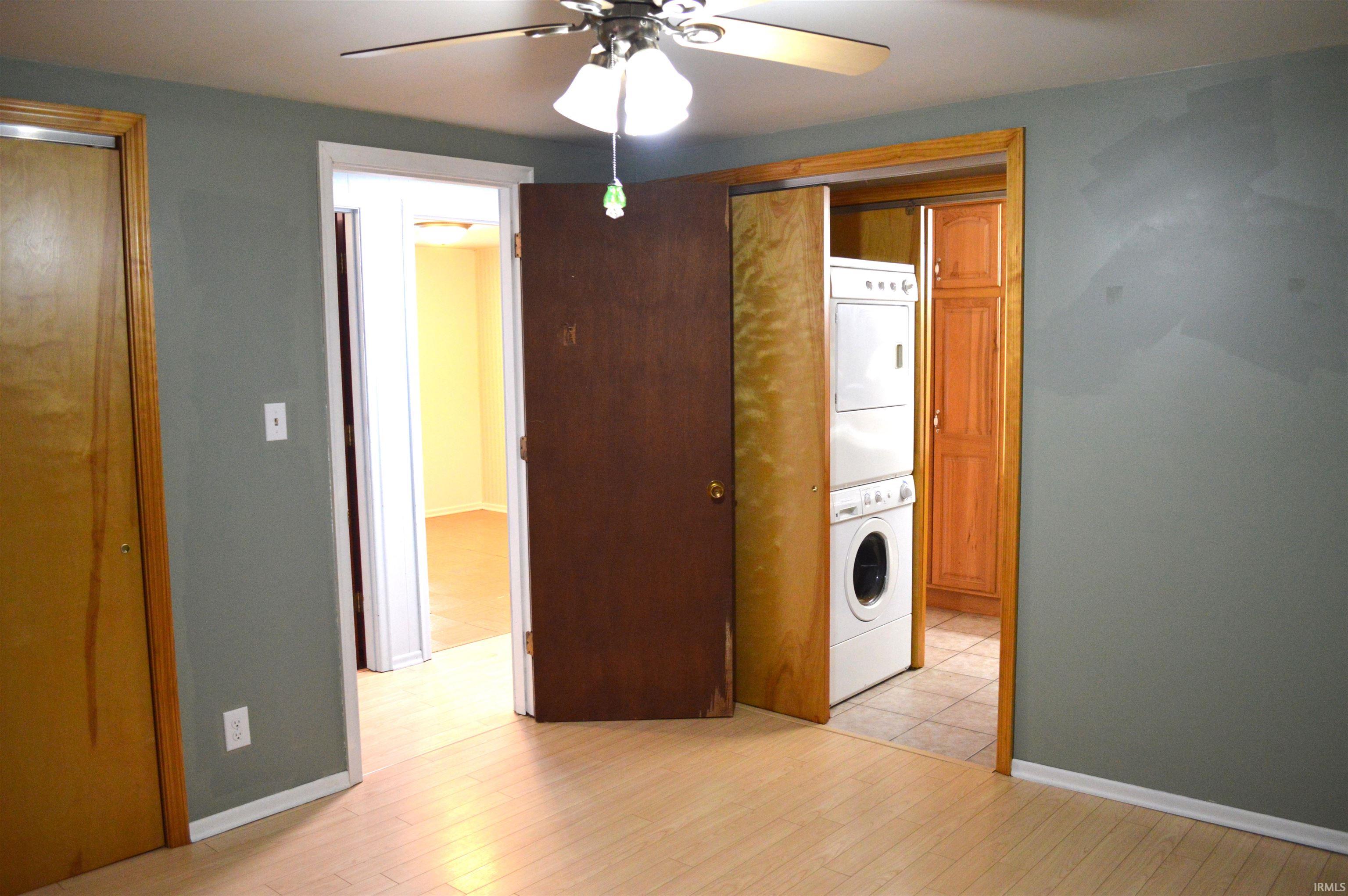 Master bedroom view into pass through bathroom and main level laundry. Really convenient!