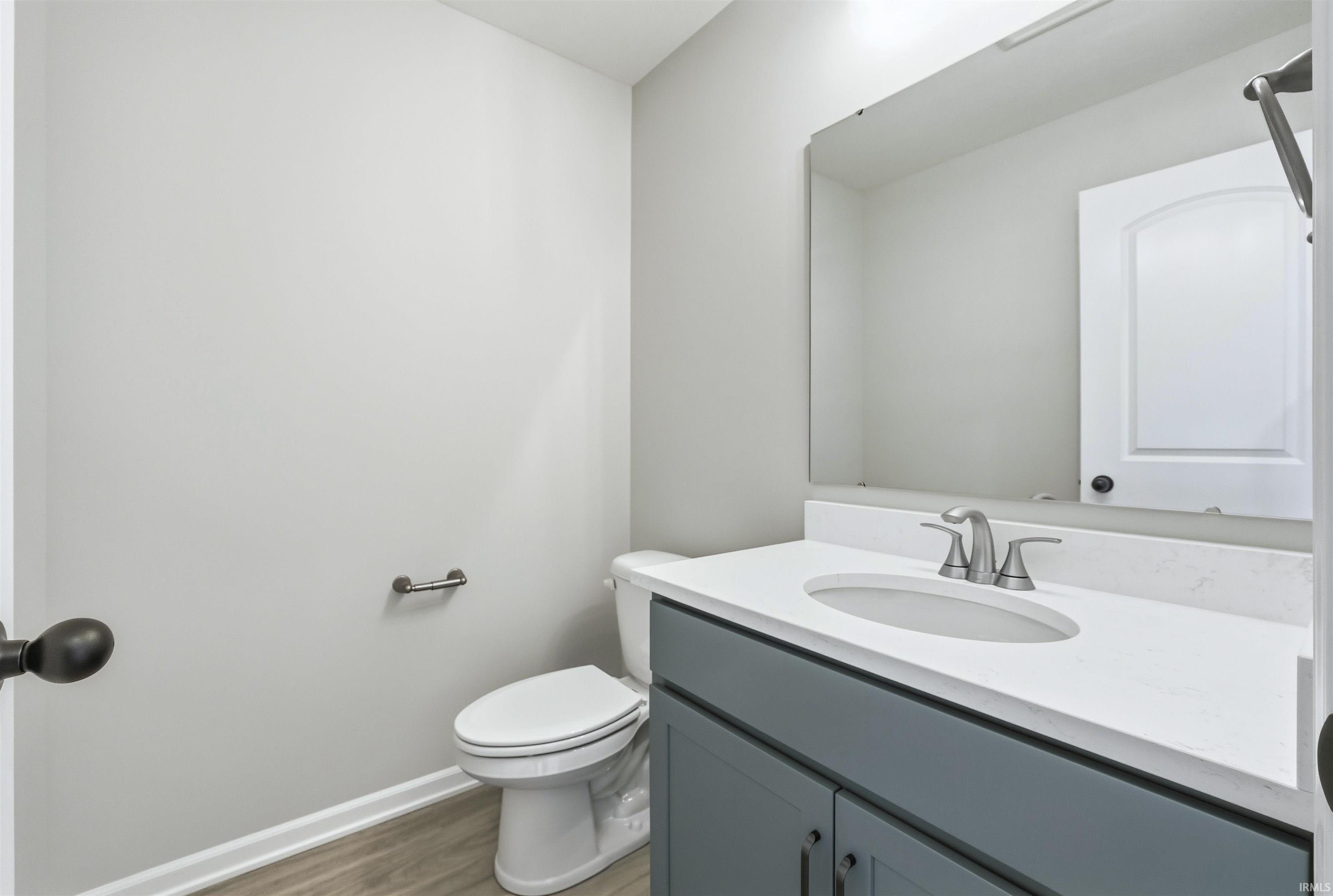 Bathroom featuring vanity and light wood-type flooring