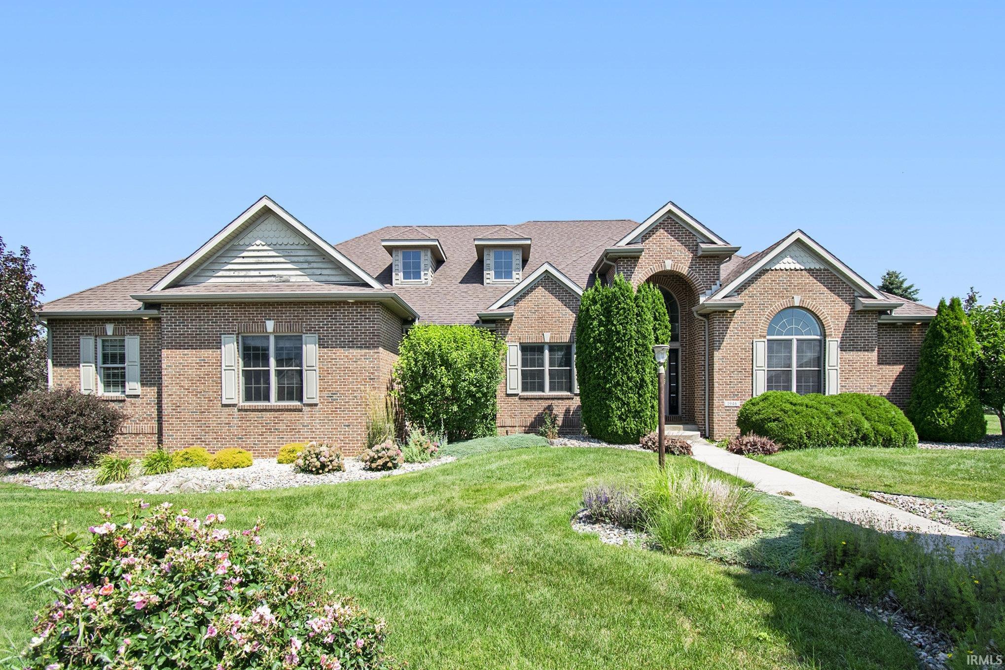 Luxury All Brick 5-Bedroom Home with Heated Pool, Finished Basement & Incredible Garage Space!