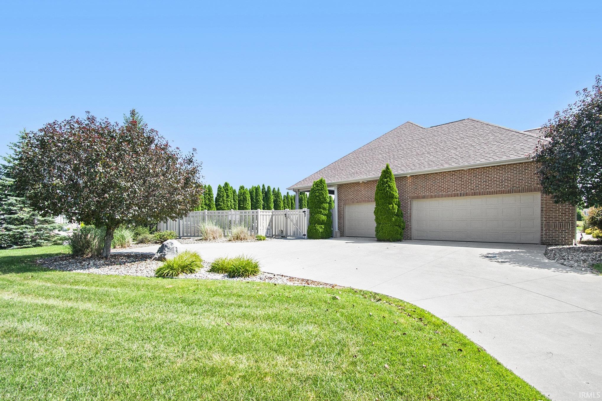 Impressive & Oversized 3-Car Heated Garage Offers 12-foot Ceilings—Perfect for a Workshop, Storage, or Car Lifts.