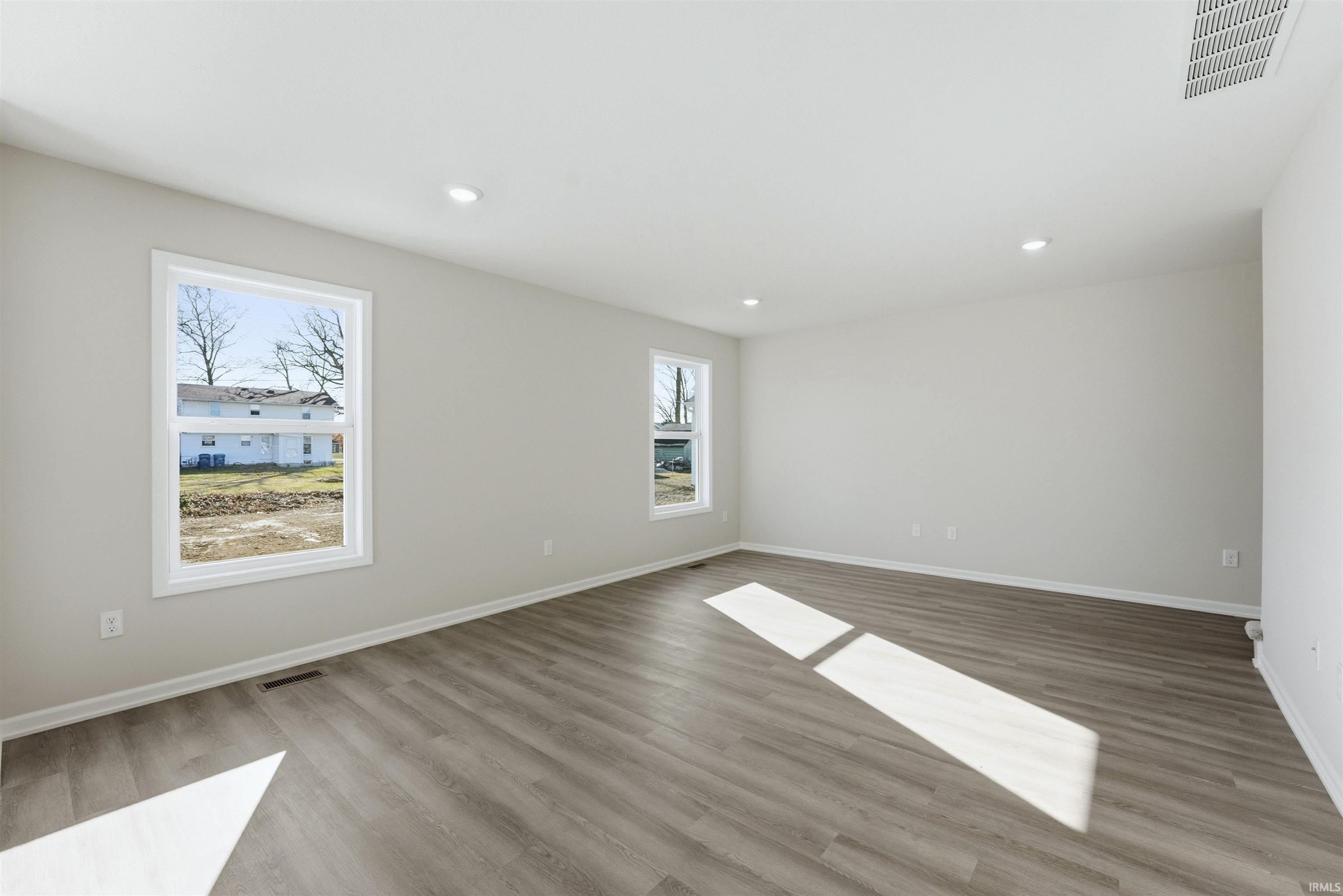 light wood finished floors and recessed lighting