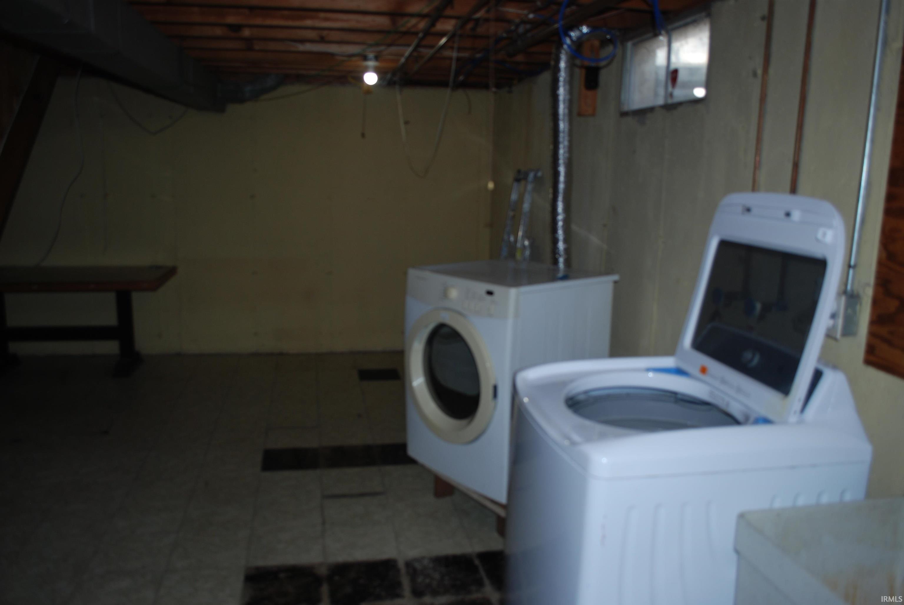 Laundry area featuring separate washer and dryer