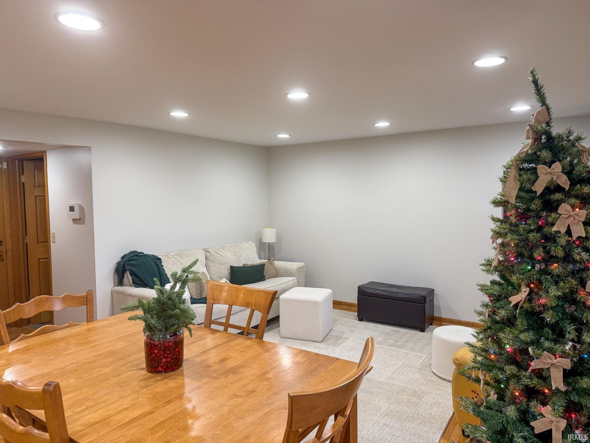 Dining space featuring recessed lighting