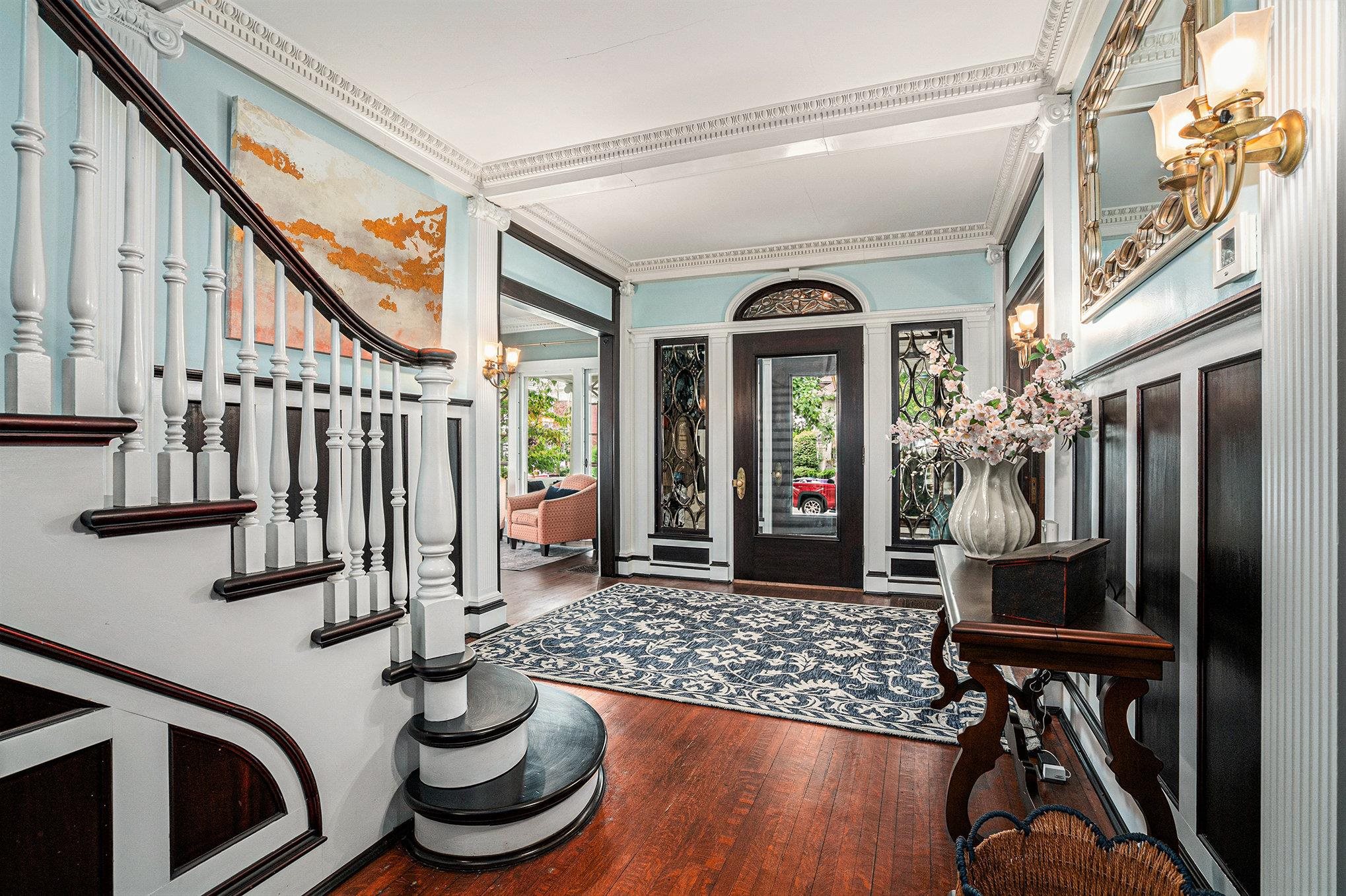 Beautifully refinished & restored millwork and stairway.